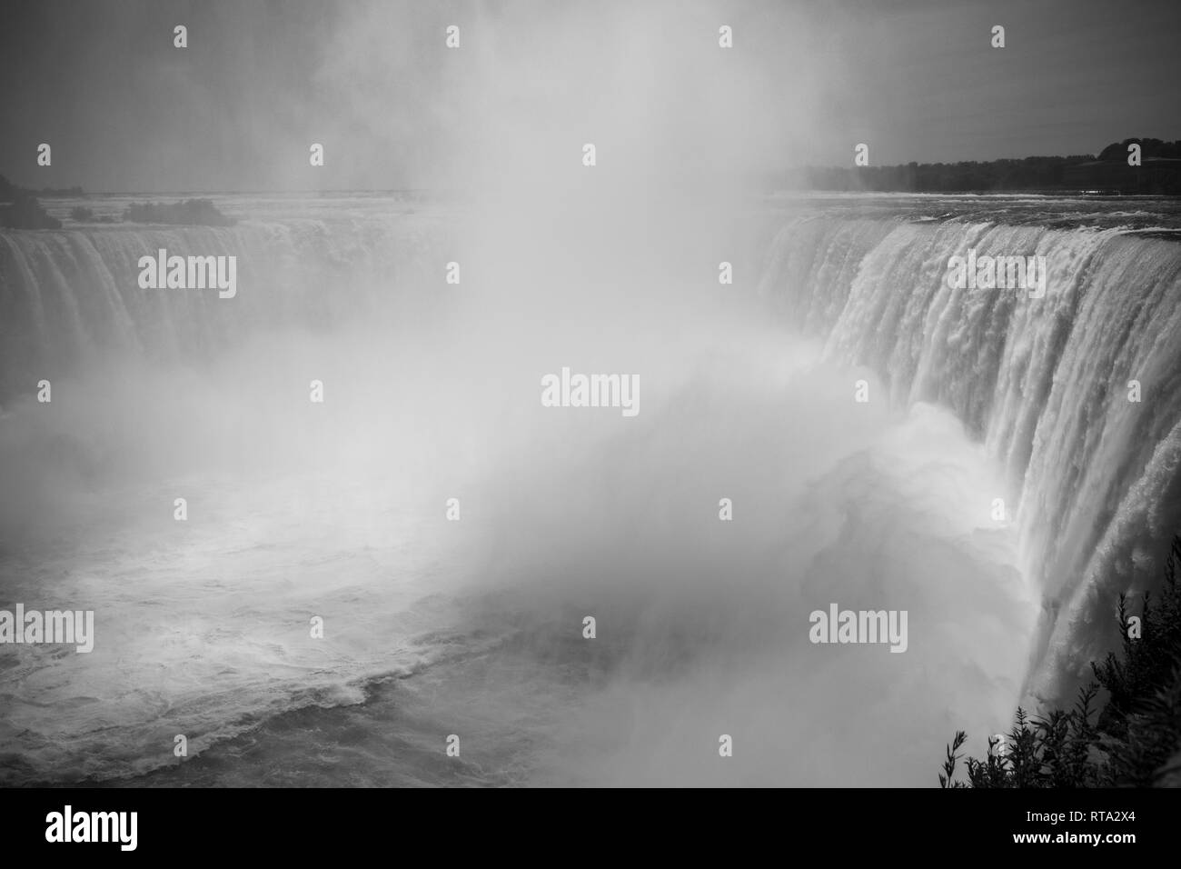 Niagara Falls fury, aged photo style. The spectacular Horseshoe Fall that lies on the border of the United States and Canada. Stock Photo
