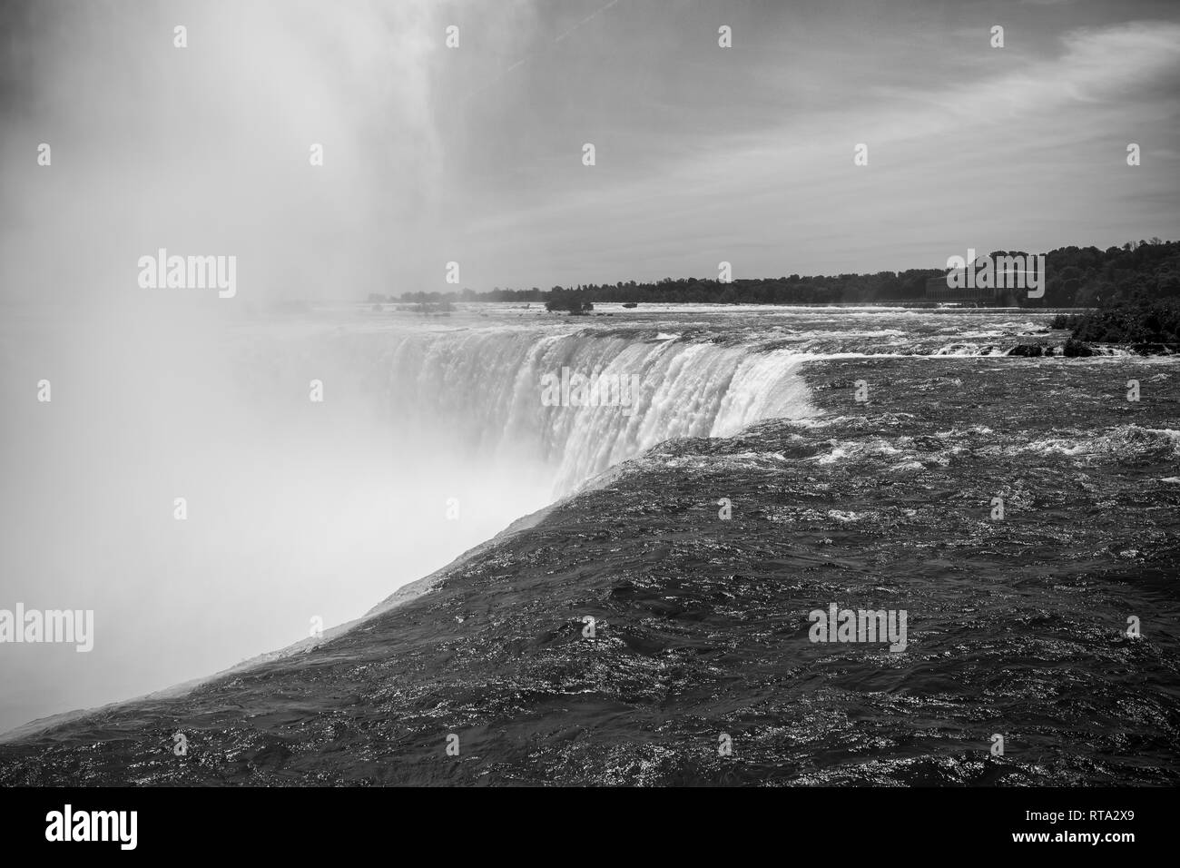 On the top of the Niagara Falls. Black and White. The spectacular Horseshoe Fall that lies on the border of the United States and Canada Stock Photo