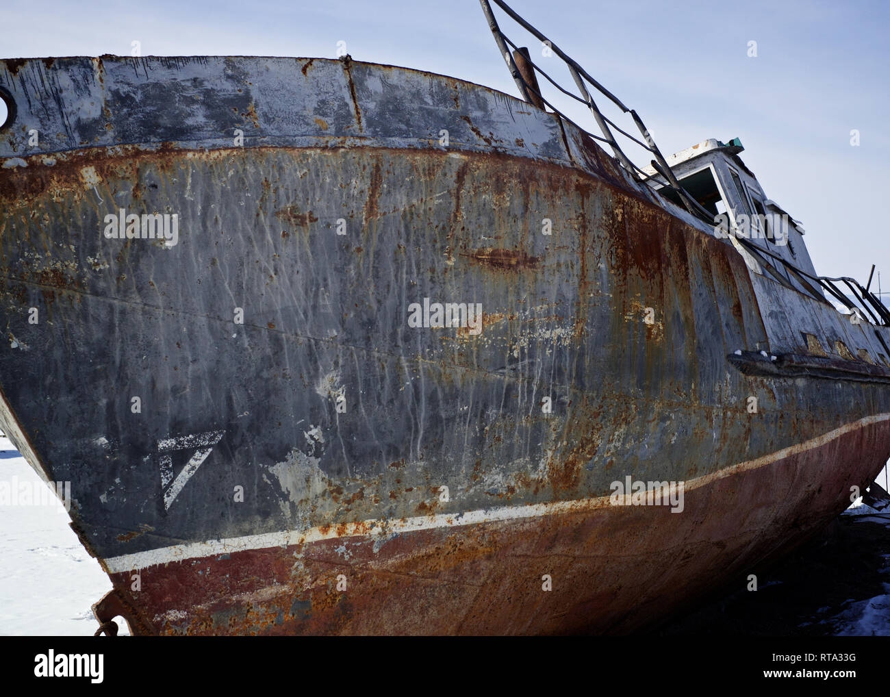 Old iron boat at Kougir harbour on Olkhon Island, Lake Baikal, Bouriatia, Siberia, Russia Stock Photo
