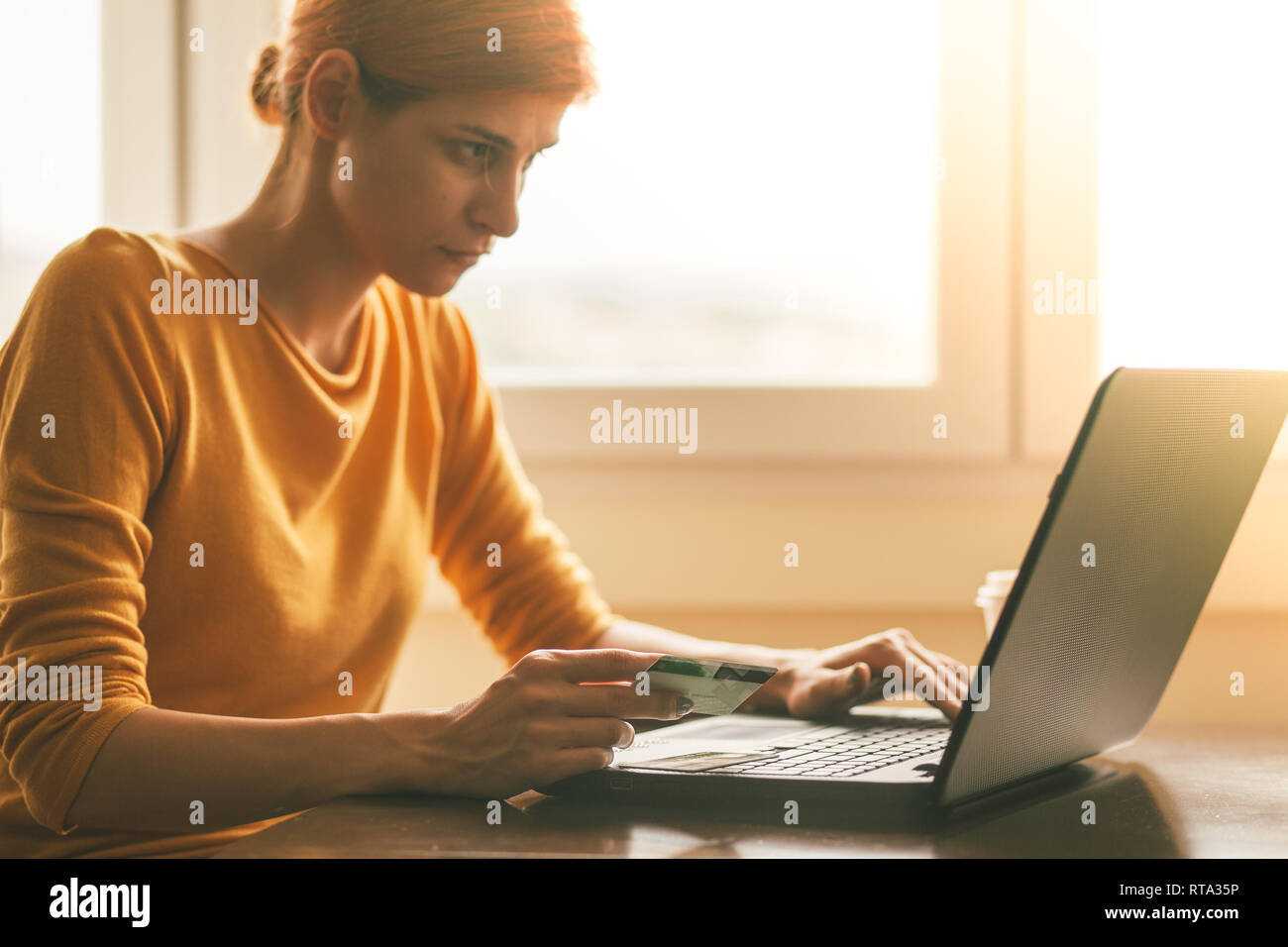 Young woman doing online shopping Stock Photo