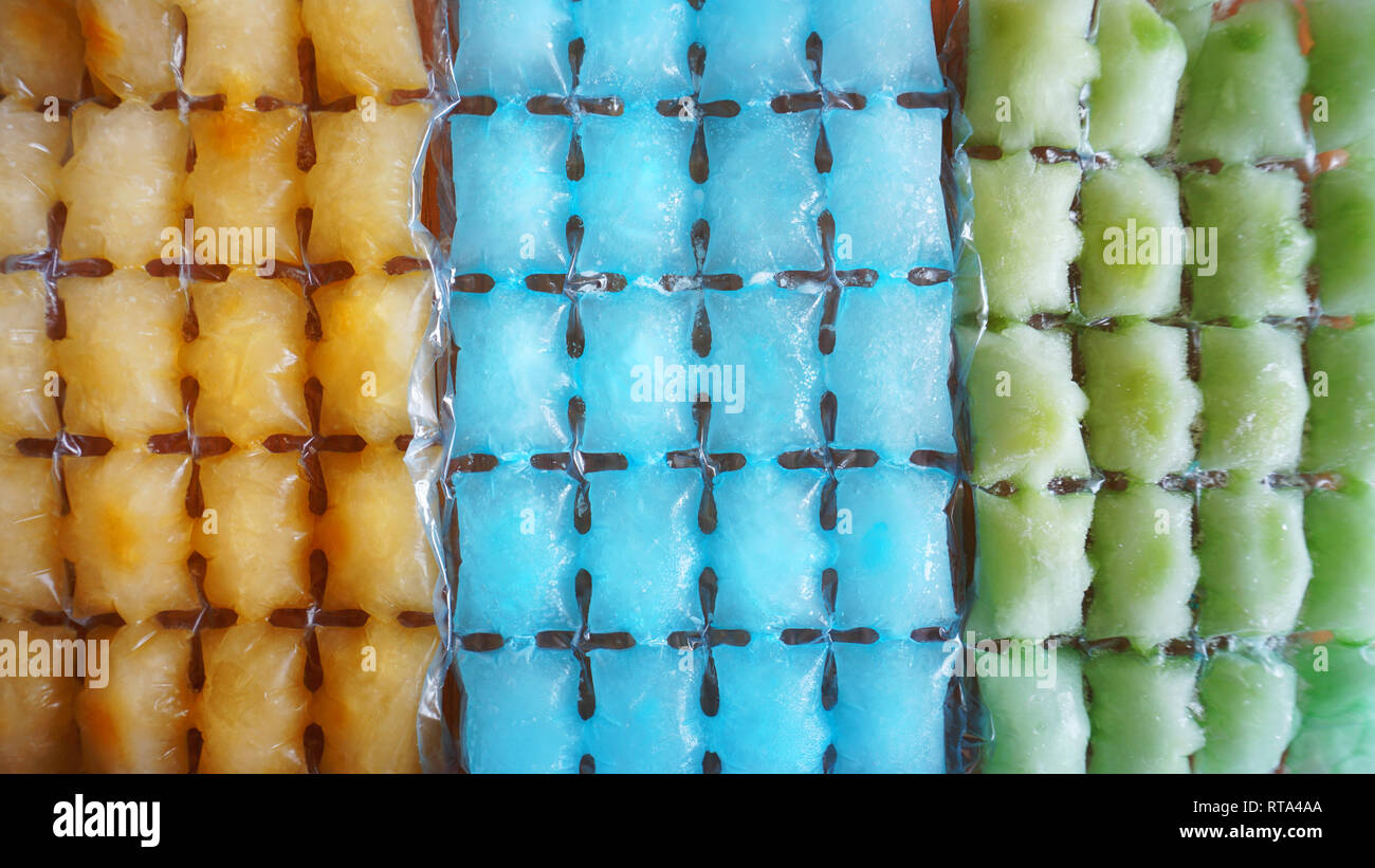 Colorful ice cubes background frozen fruit ice Stock Photo Alamy