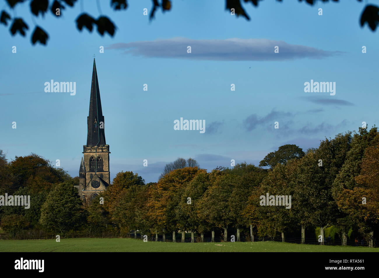 Spire of Holy Trinity church in the verdant english landscape of