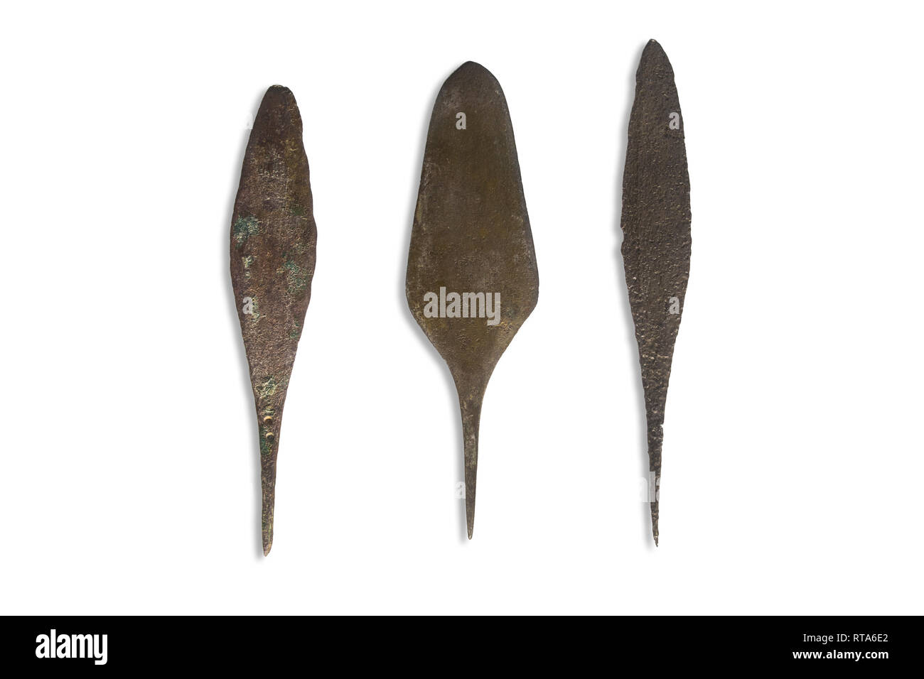 Cordoba, Spain - September 8th, 2018: 3 primitive metal arrowheads Palmela type at Archaeological Museum of Cordoba, Spain Stock Photo