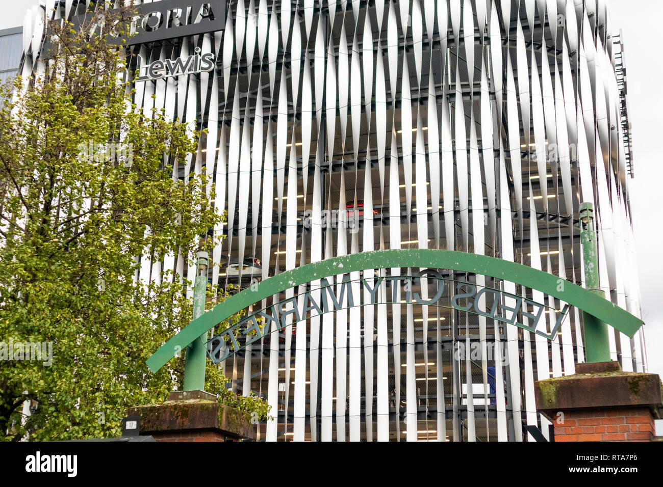 The entrance sign for Leeds City Markets in the shadow of the new John
