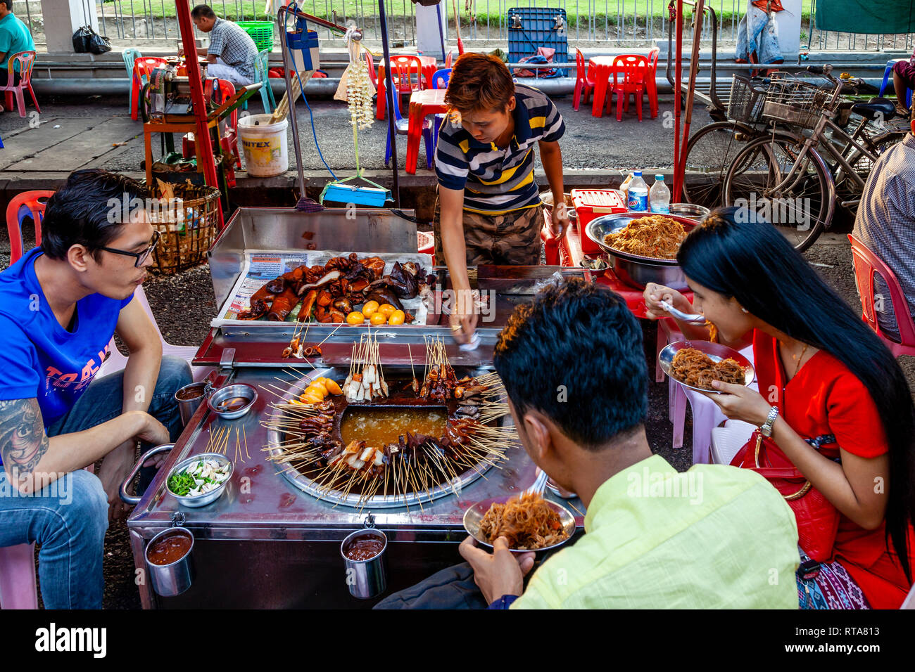 Young People Eating Street Food, Yangon, Myanmar Stock Photo