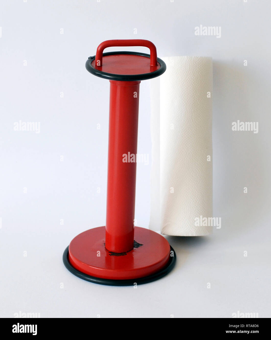 Vintage kitchen roll holder, red enamelled metal Stock Photo