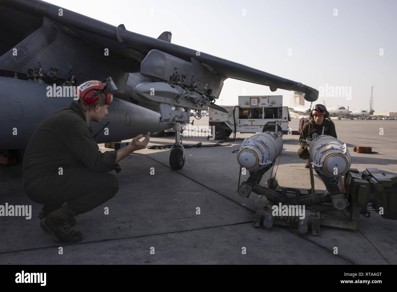 U S Marine Cpl Luke Gumm Left A Team Leader With Marine Attack Squadron 223 Attached To Special Purpose Marine Air Ground Task Force Crisis Response Central Command Observes As Lance Cpl Angel Marin Loads
