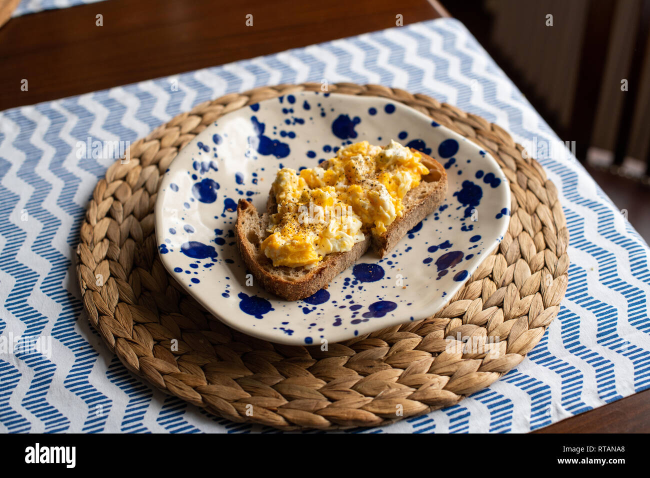 Scrambled eggs with toasted bread Stock Photo