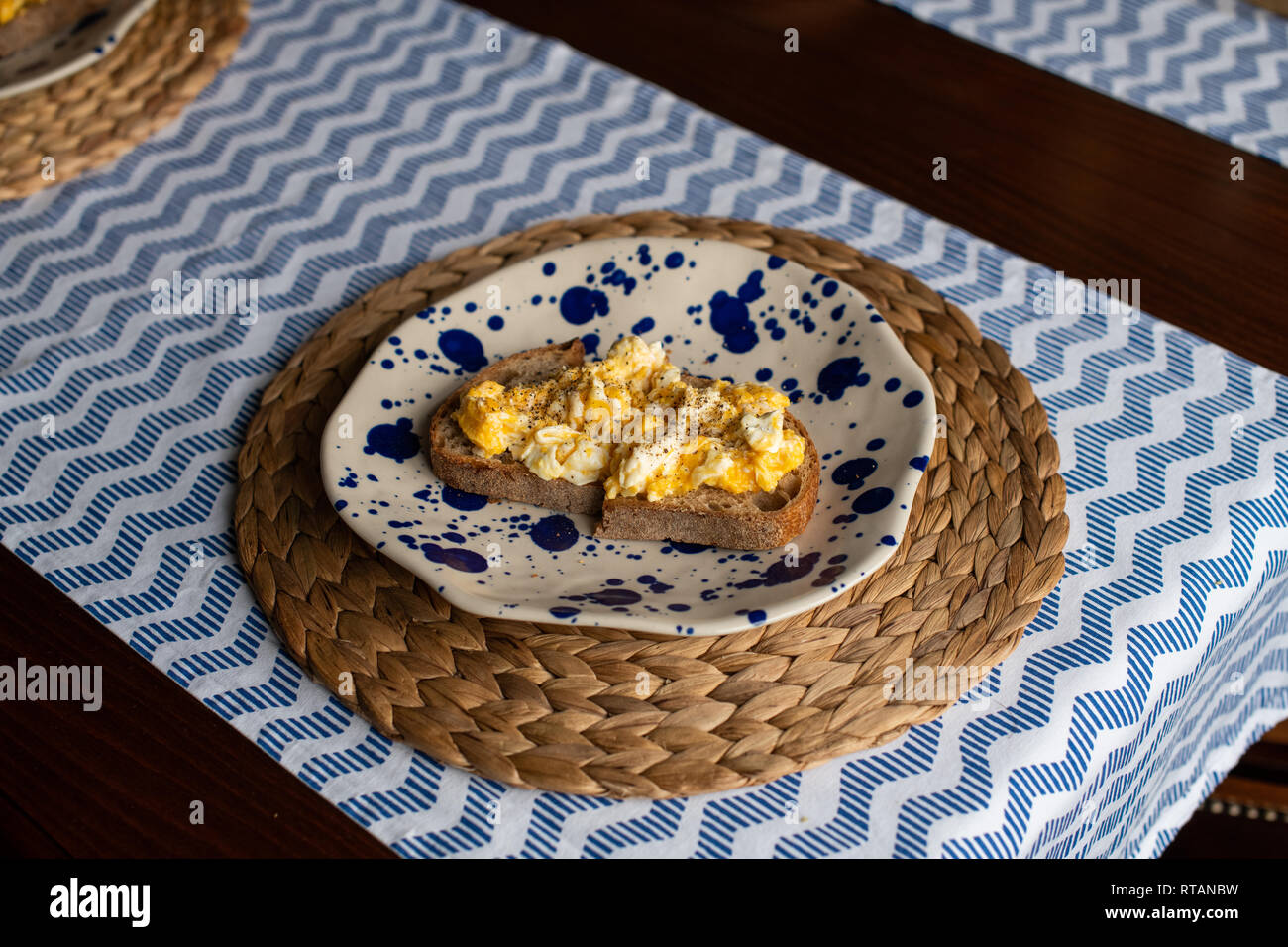 Scrambled eggs with toasted bread Stock Photo