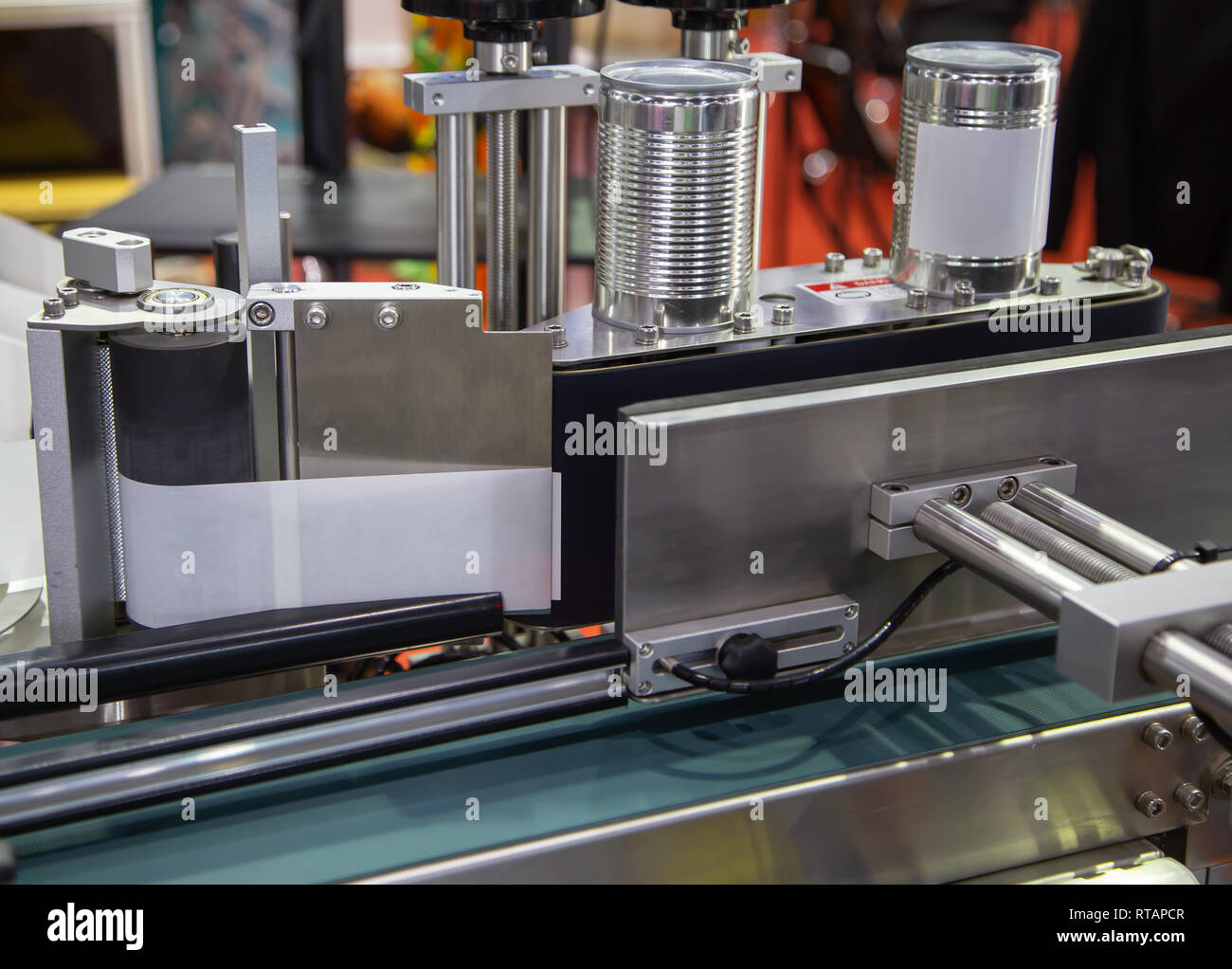 Full automatic tin can label machine in food production line Stock Photo