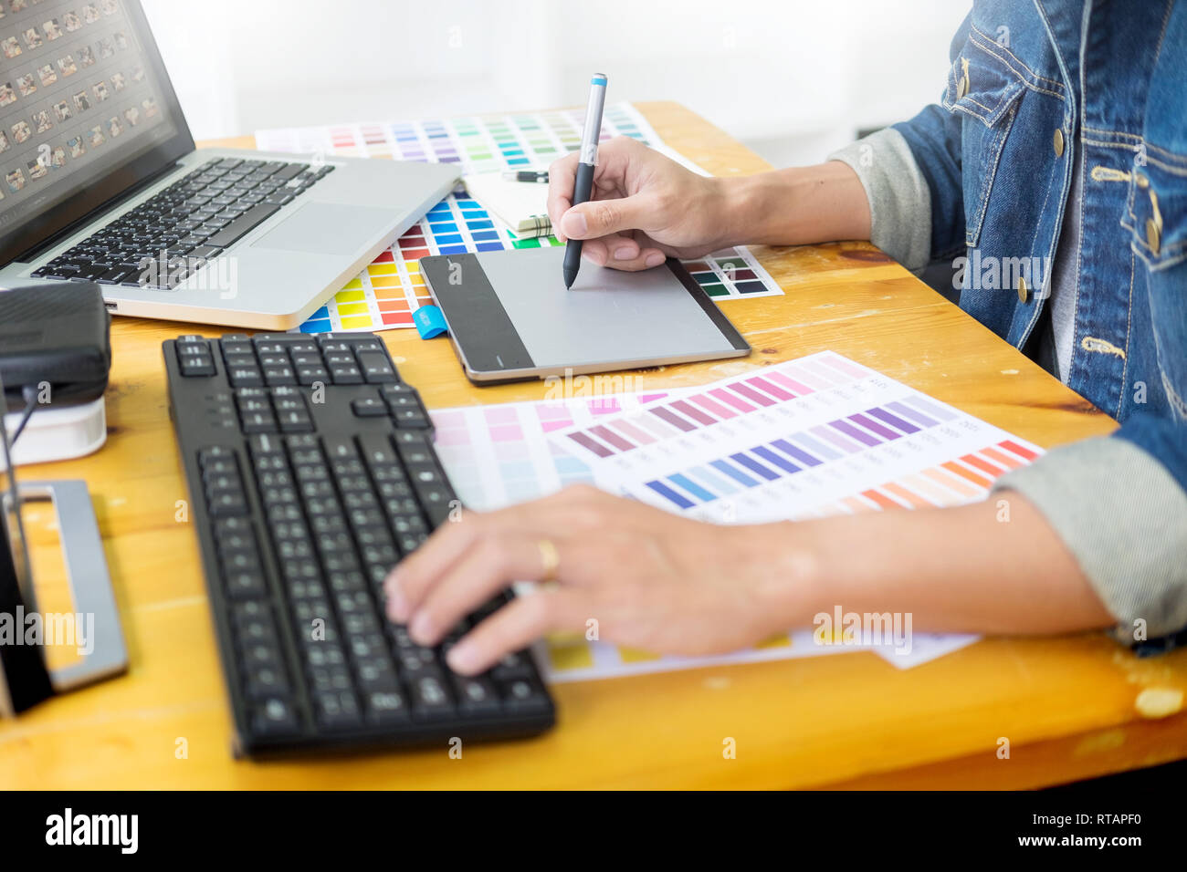 Graphic Designer Team Working On Web Design Using Color Swatches