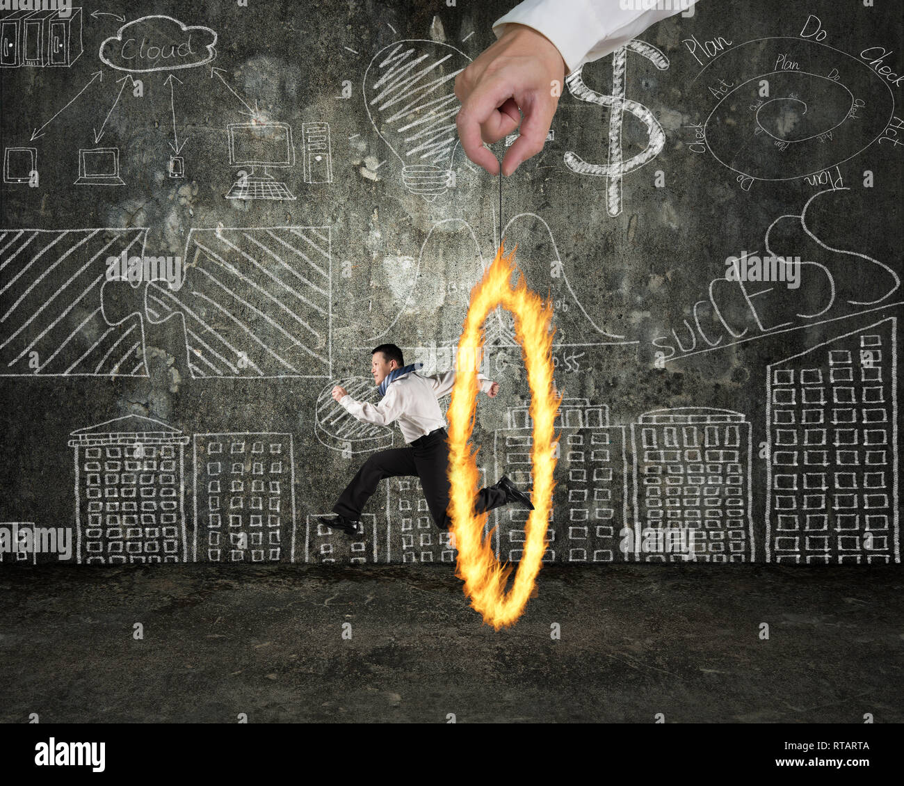 Man jumping through fire circle hand holding with doodles wall background Stock Photo Alamy