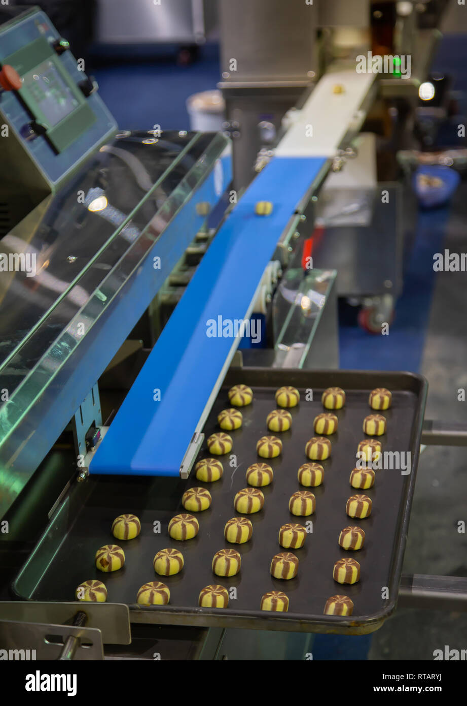 Production line of automatic two color cookie making machine Stock ...