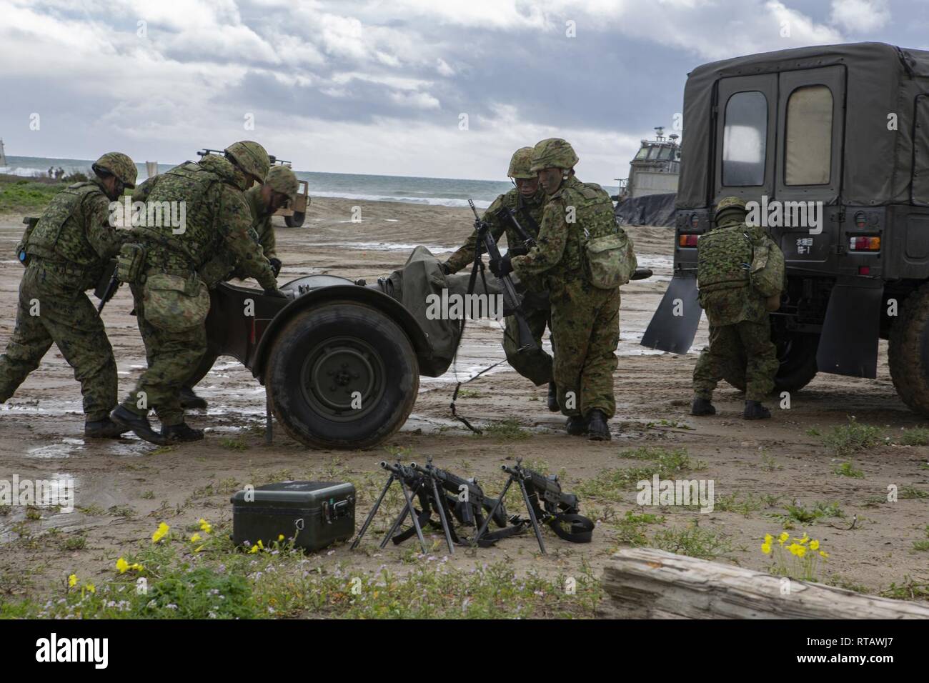 Japan Ground Self-Defense Force (JGSDF) Soldiers begin to set up a mortar trailer during an amphibious landing exercise for Iron Fist 2019, Feb. 4, on U.S. Marine Corps Base Camp Pendleton, CA. Exercise Iron Fist is an annual, multilateral training exercise where U.S. and Japanese service members train together and share techniques, tactics and procedures to improve their combined operational capabilities. Stock Photo
