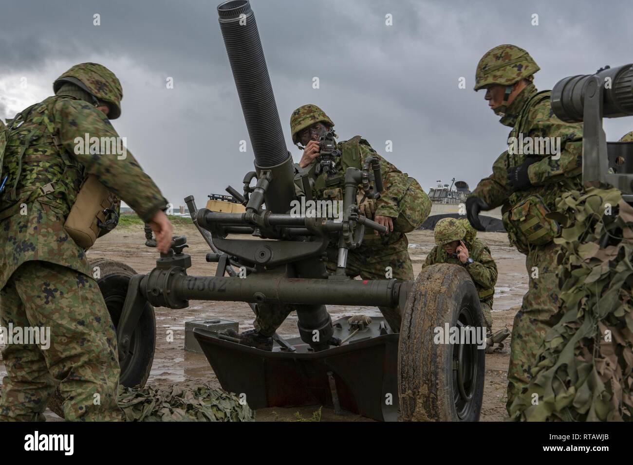 Japan Ground Self-Defense Force (JGSDF) Soldiers execute a simulated call to fire using a 120mm mortar for an amphibious landing exercise during Iron Fist 2019, Feb. 4, on U.S. Marine Corps Base Camp Pendleton, CA. Exercise Iron Fist is an annual, multilateral training exercise where U.S. and Japanese service members train together and share techniques, tactics and procedures to improve their combined operational capabilities. Stock Photo