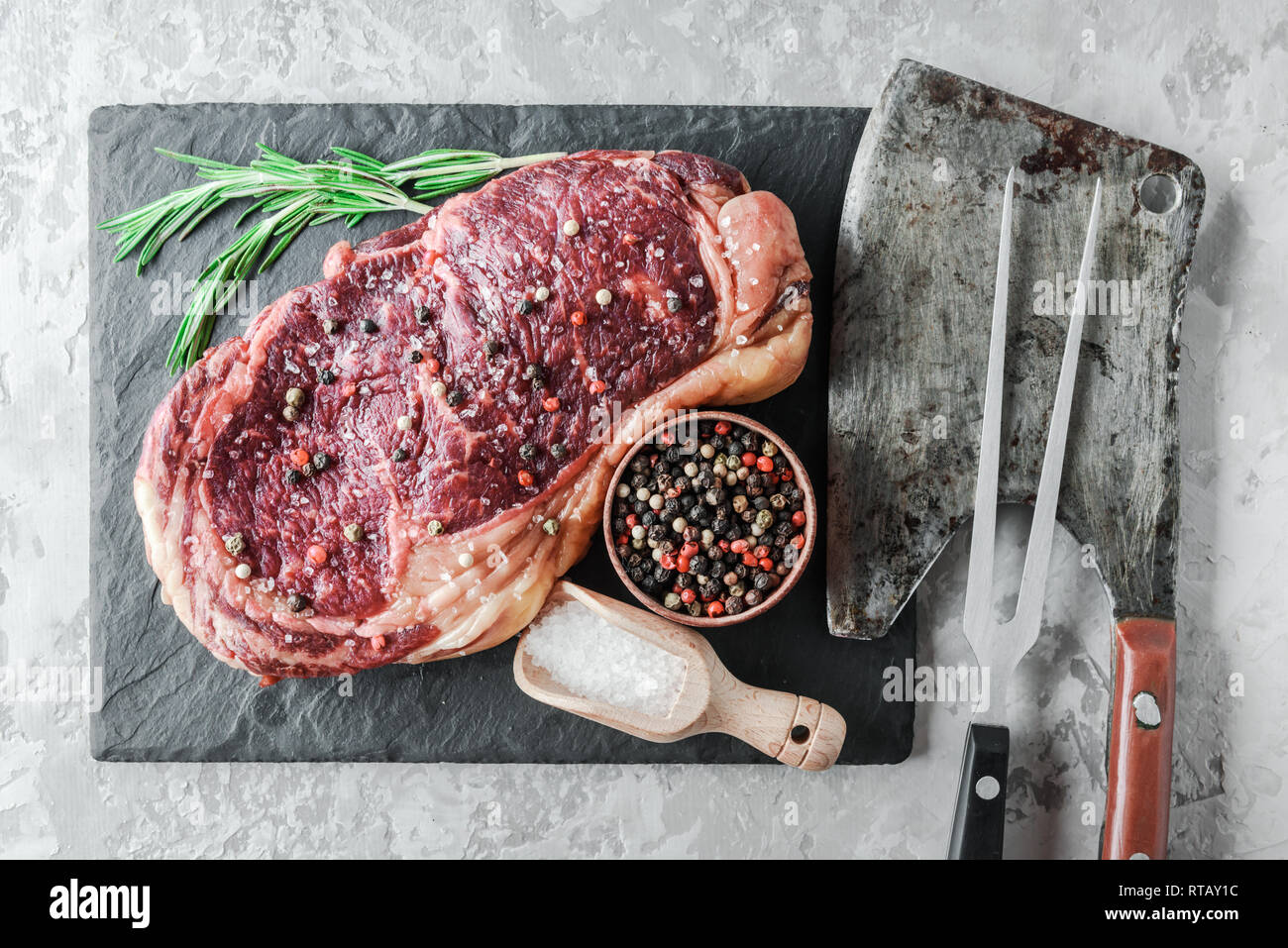 Marbling ribeye steak on white wood plate. Prime rib beef chop Stock Photo