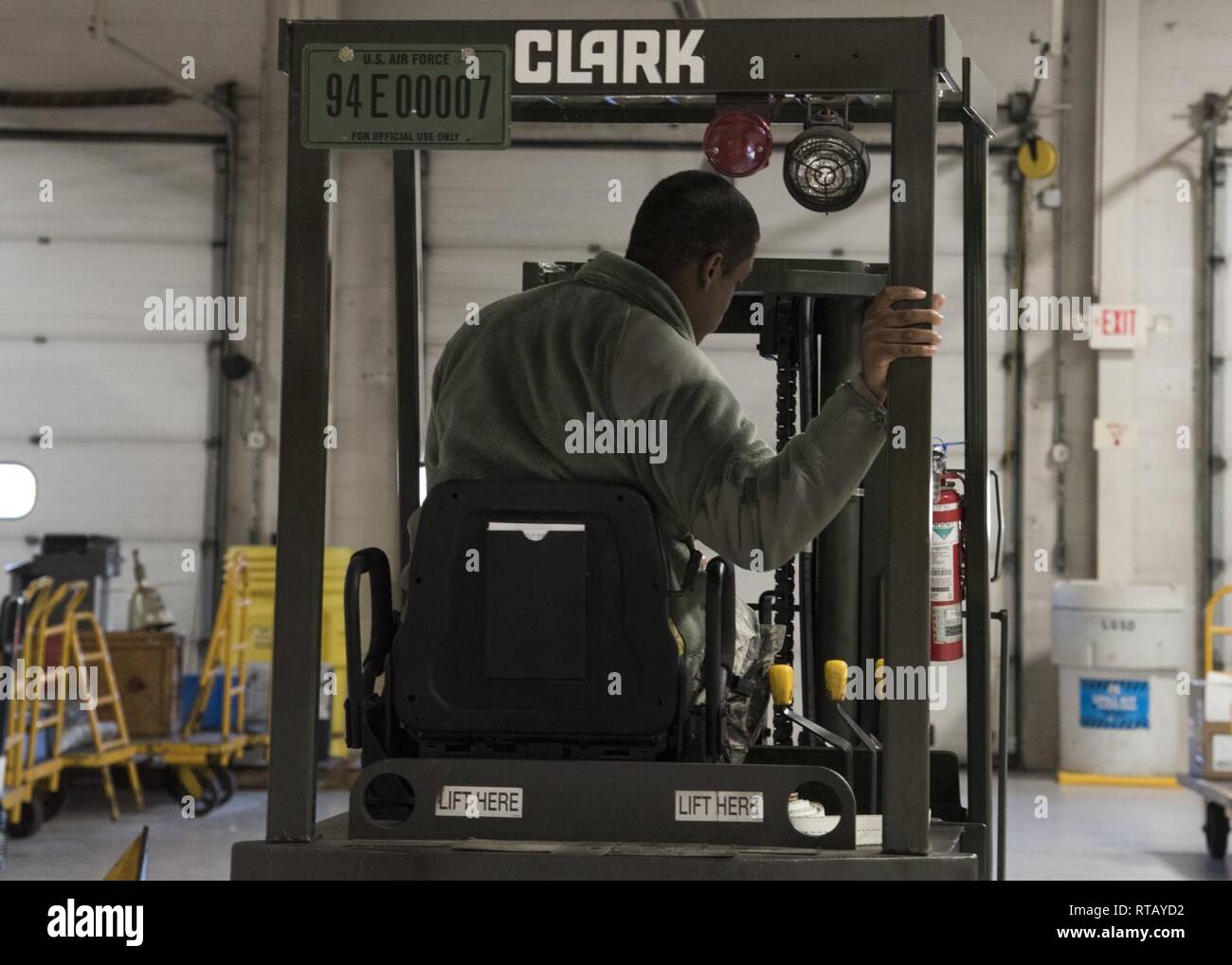 Airman Anthony Lemarc Cole Jr., a traffic management specialist, 108th Logistics Readiness Squadron, parks a forklift in the LRS supply warehouse at Joint Base McGuire-Dix-Lakehurst, N.J., Feb. 4, 2019. In his year and two months of service, Cole said his proudest moment so far was passing his career development course test and becoming a temporary technician within his shop. Stock Photo