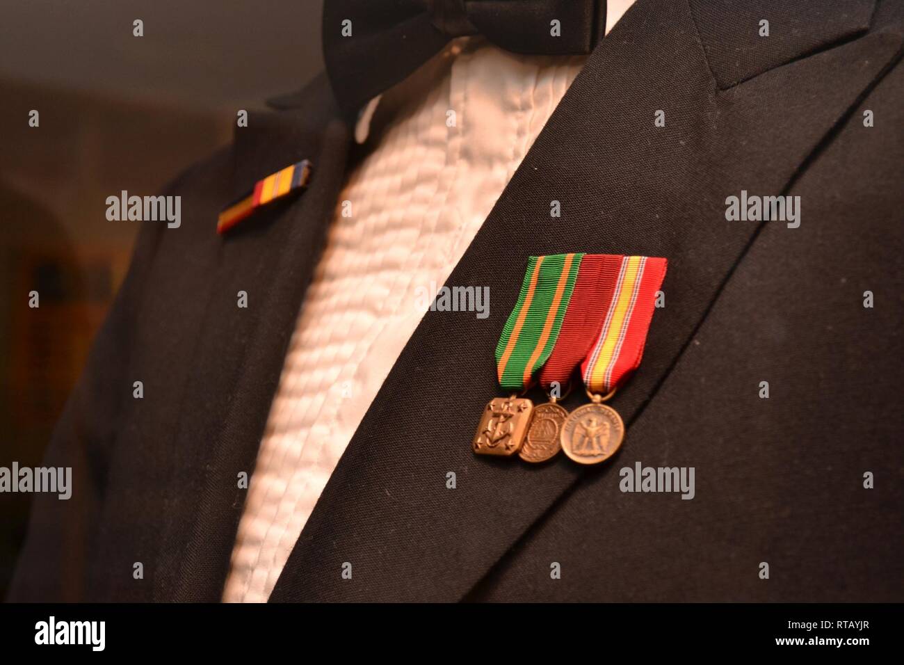 Accession #2019-001. Uniform, Master Chief Petty Officer. The dress mess  blue uniform belonging to Master Chief Petty Officer Stan White is on  display in the Cold War gallery of the Hampton Roads