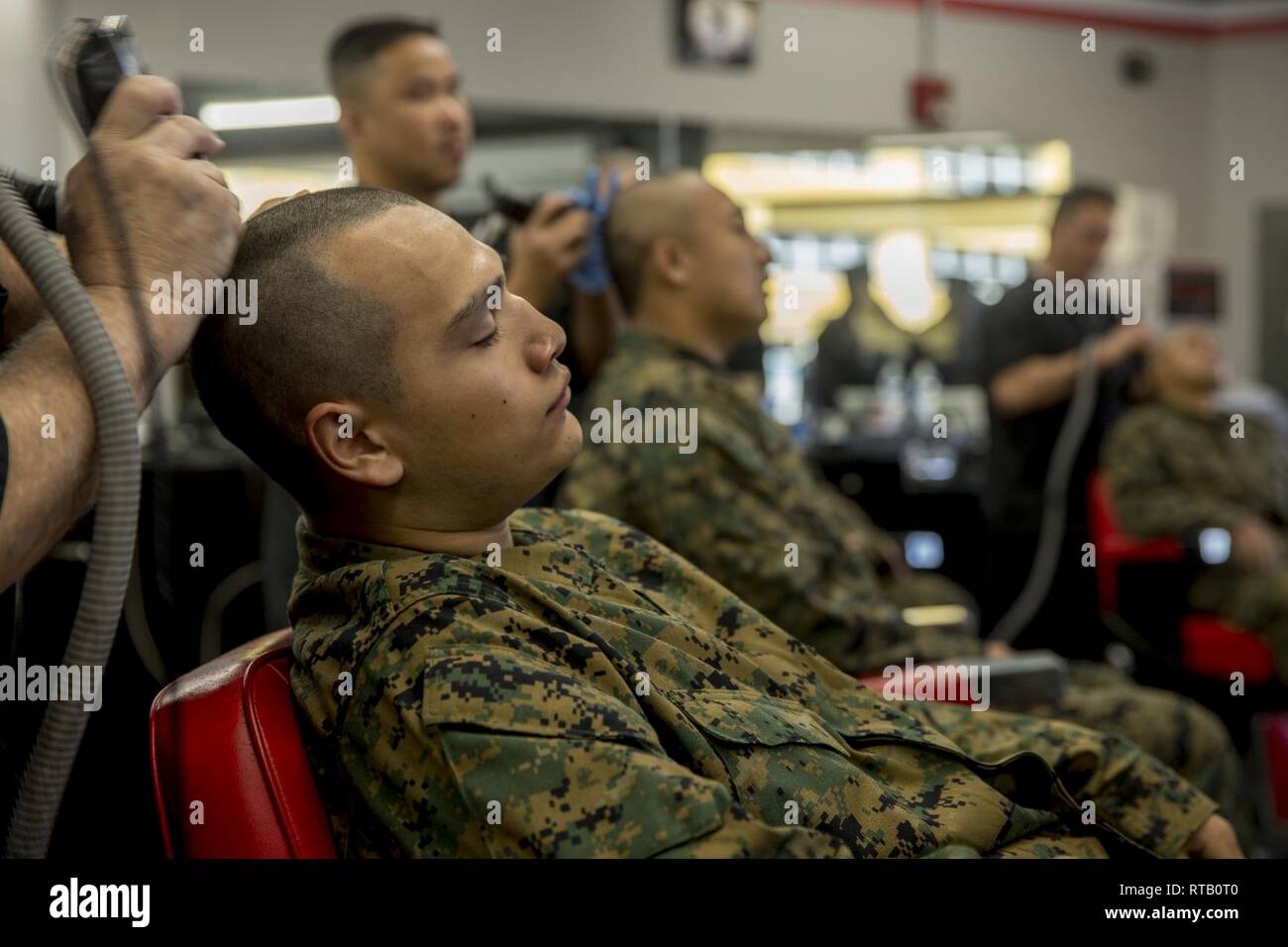 A recruit from India Company 3rd Recruit Training Battalion receives a  haircut at Marine Corps Recruit Depot San Diego Feb 5 Recruits receive a  weekly haircut throughout training to remove the individuality