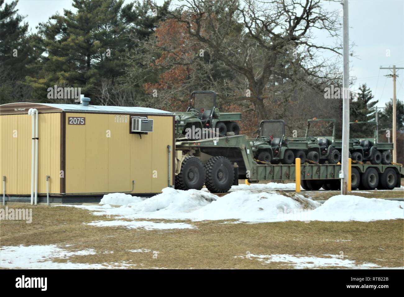 Military vehicles and equipment with the 389th Engineer Battalion are weighed at the scale prior to being loaded on railcars Feb. 5, 2019, at Fort McCoy, Wis. The movement is for the 389th’s future involvement in Operation Resolute Castle 2019 in Poland. Unit Soldiers loaded 38 cars with vehicles and equipment after receiving training in a rail head operations class by representatives of Marine Corps Logistics Base-Barstow, Calif. Fort McCoy’s Logistics Readiness Center personnel assisted with the loading operations. Stock Photo