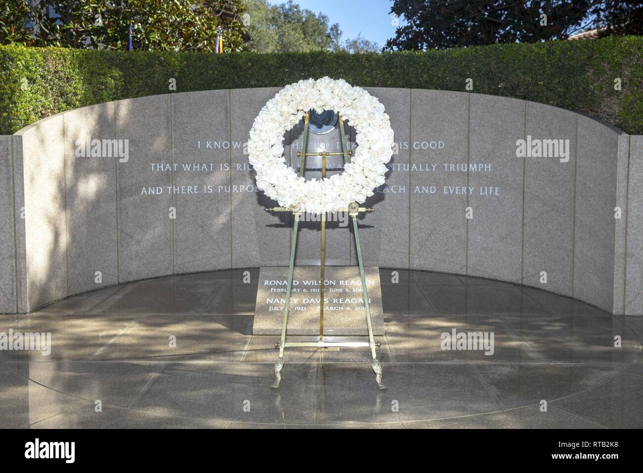A ceremonial wreath is displayed in front of the Ronald Reagan memorial during the Ronald Reagan Wreath Laying ceremony at the Ronald Reagan Presidential Foundation and Library, Simi Valley, California, Feb. 6, 2019. The ceremony was held in honor of President Reagan as a tribute to his faithful service to the United States, and in celebration of what would have been his 108th birthday. Stock Photo