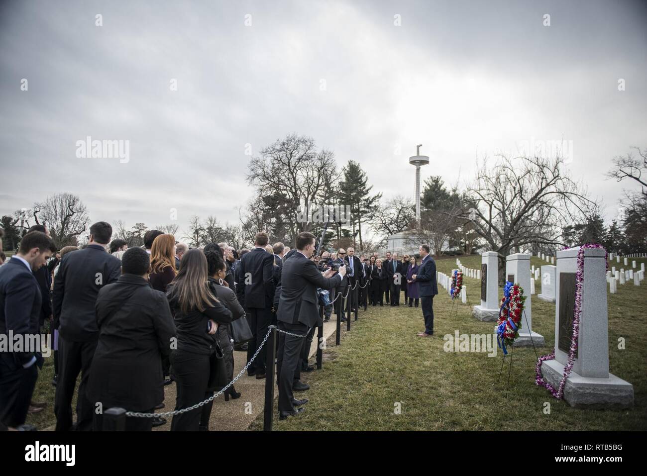 NASA Administrator Jim Bridenstine (center) gives remarks aftera wreath-laying ceremony at the Challenger and Columbia memorial as part of the NASA Day of Remembrance at Arlington National Cemetery, Arlington, Virginia, Feb. 7, 2019. This annual event pays tribute “to the crews of Apollo 1 and space shuttles Challenger and Columbia, as well as other NASA colleagues who lost their lives while furthering the cause of exploration and discovery,” according to NASA. Stock Photo
