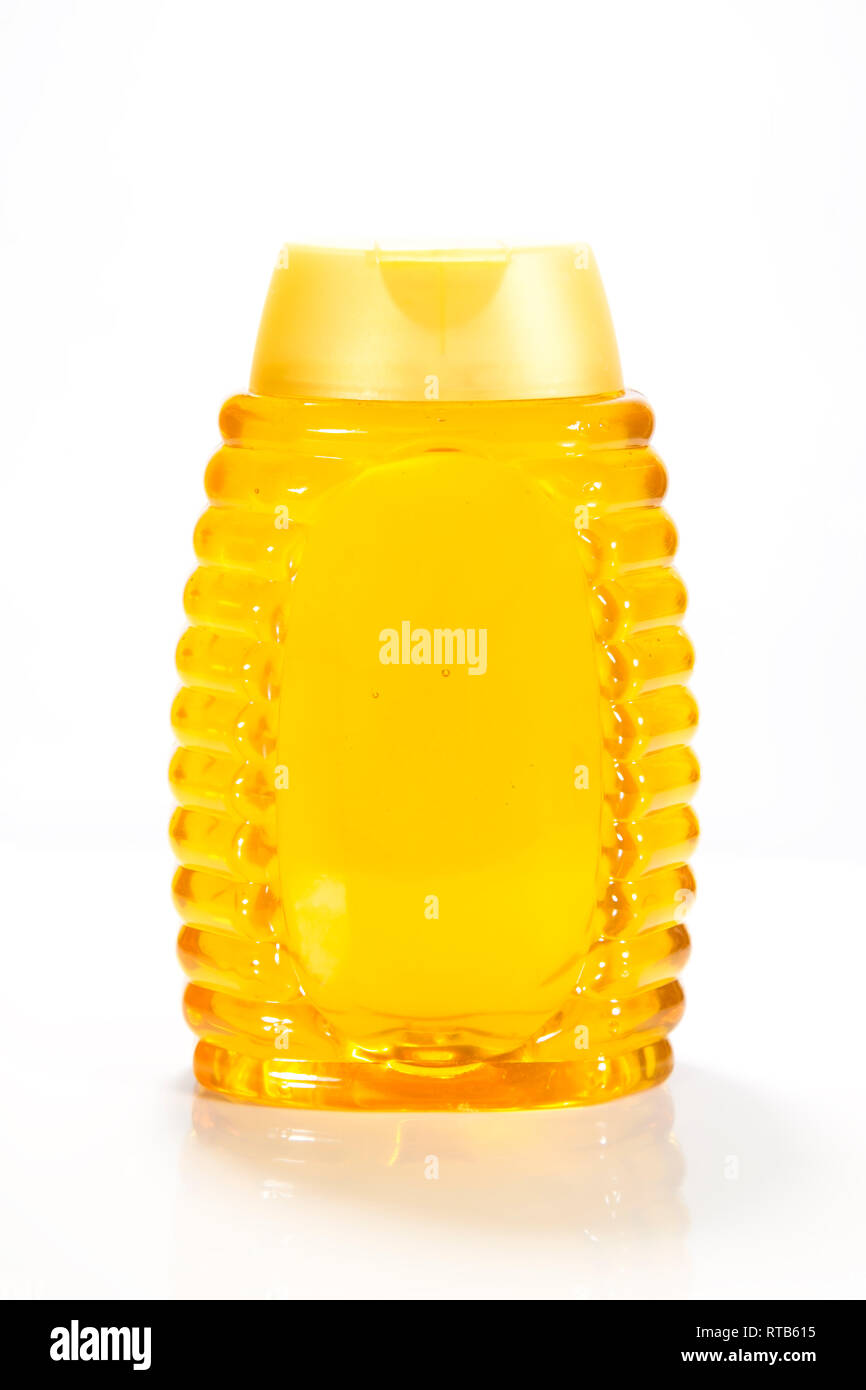 Honey bottle isolated on white background Stock Photo