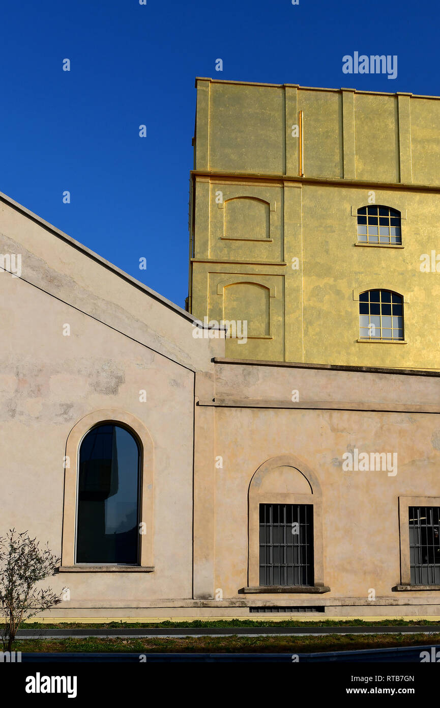 The buildings of the Fondazione Prada complex seen from the new Adriano Olivetti square, in the Symbiosis district Stock Photo