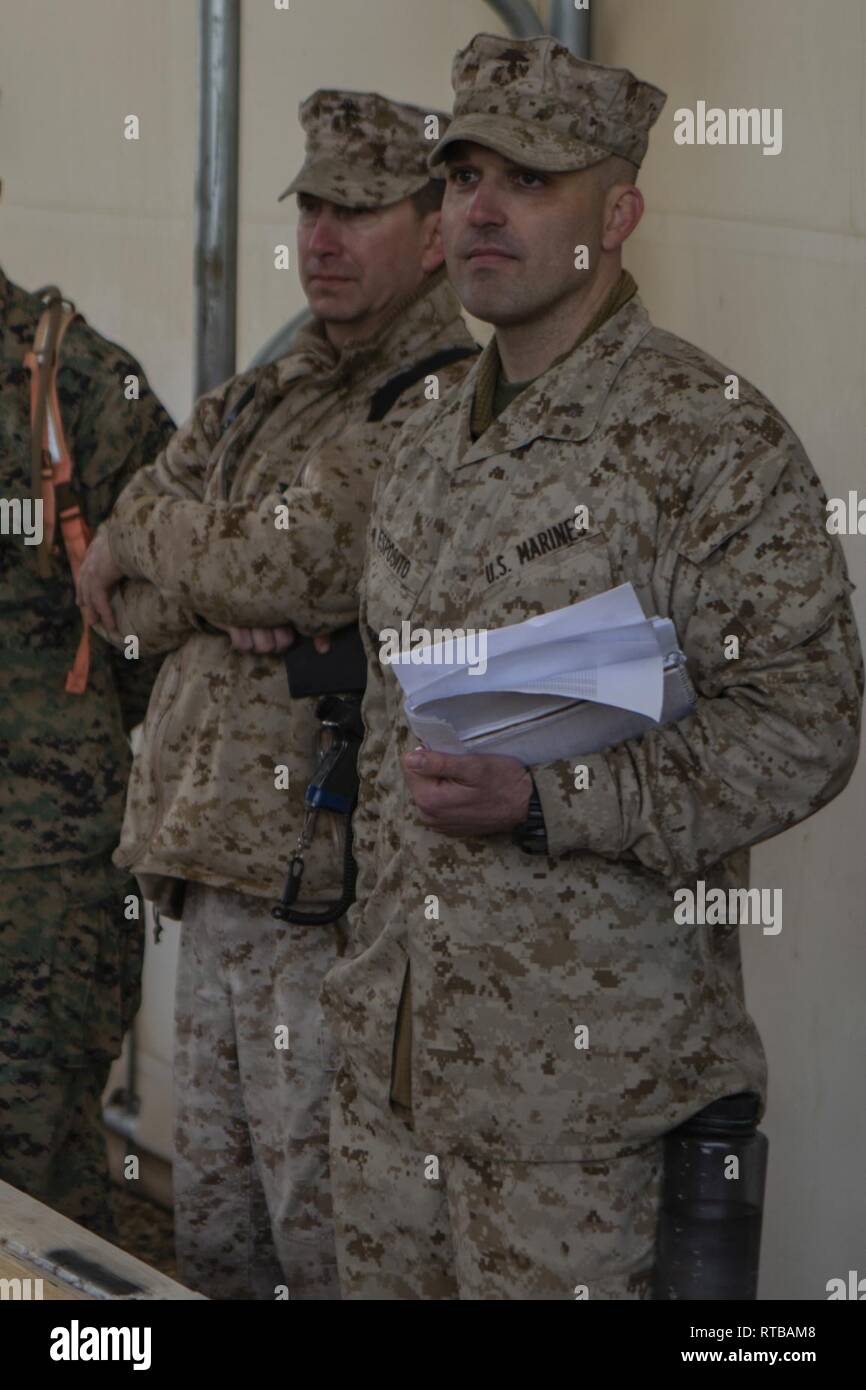 U.S. Marines Col. Daniel T. Canfield Jr., the commanding officer of 6th Marine Regiment, left, and Maj. Matthew T. Esposito, the assisstant operations officer of 6th Marine Regiment, both with Marine Air-Ground Task Force-6 (MAGTF-6) observe a Rehearsal of Concept (ROC) drill in preparation for the Regimental Assault Course (RAC) during Integrated Training Exercise (ITX) 2-19 aboard Marine Corps Air-Ground Combat Center Twentynine Palms, Calif., Feb. 2, 2019. ITX creates a challenging, realistic training environment that produces combat-ready forces capable of operating as an integrated MAGTF. Stock Photo
