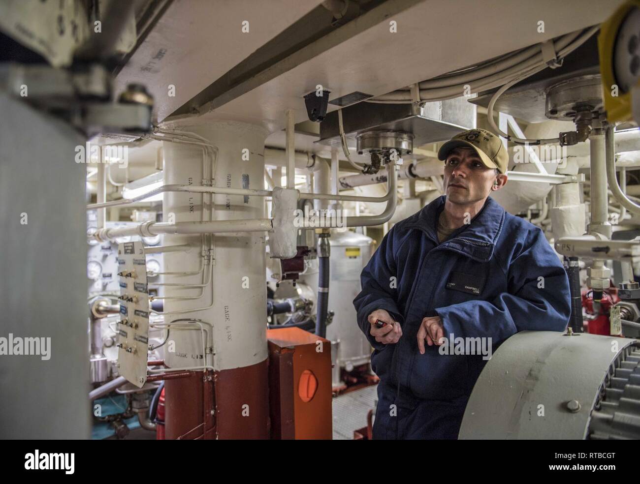 COPENHAGEN, Denmark (Feb. 03, 2019) – Hull Maintenance Technician 1st Class Jimmy Campbell does a maintenance check in aft steering aboard the Arleigh Burke-class guided-missile destroyer USS Porter (DDG 78) in Copenhagen, Denmark Feb 3, 2019. Porter, forward-deployed to Rota, Spain, is on its sixth patrol in the U.S. 6th Fleet area of operations in support of U.S national security interests in Europe and Africa. Stock Photo