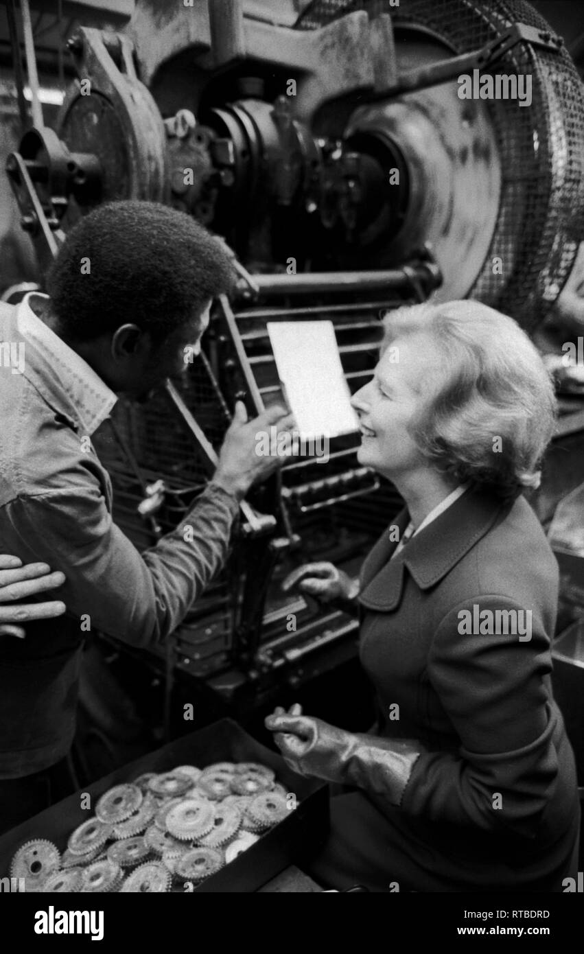 Mrs Margaret Thatcher 1979 General Election on the campaign trail. Factory visit in the West Midlands. 1970sTalking to black male factory worker. 1970s UK HOMER SYKES  UK HOMER SYKES Stock Photo