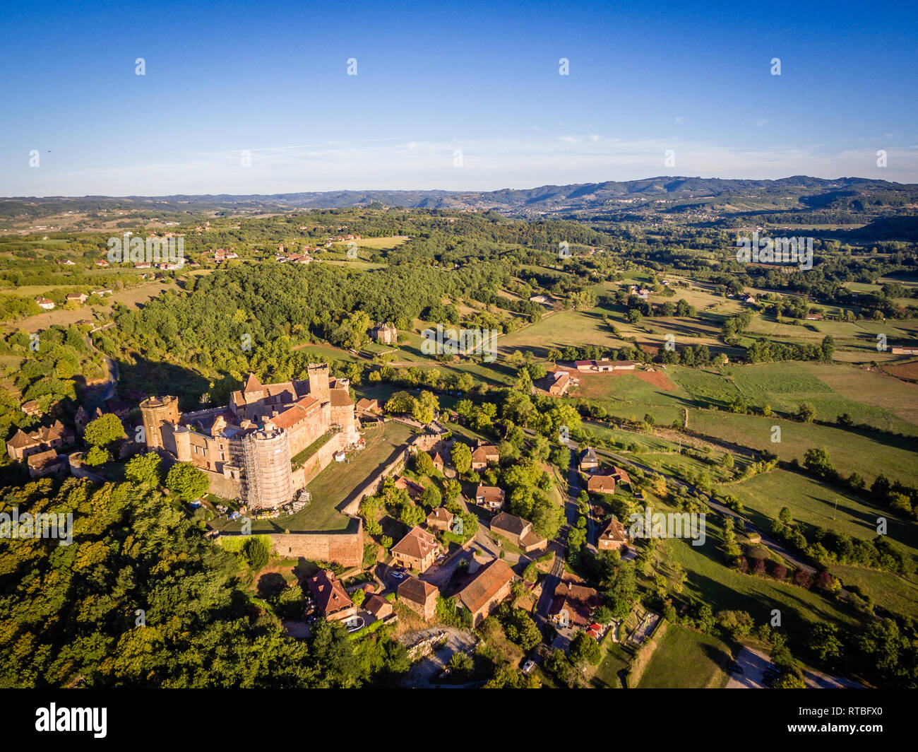 Castelnau castle in Lot, Occitanie, France at sunset Stock Photo