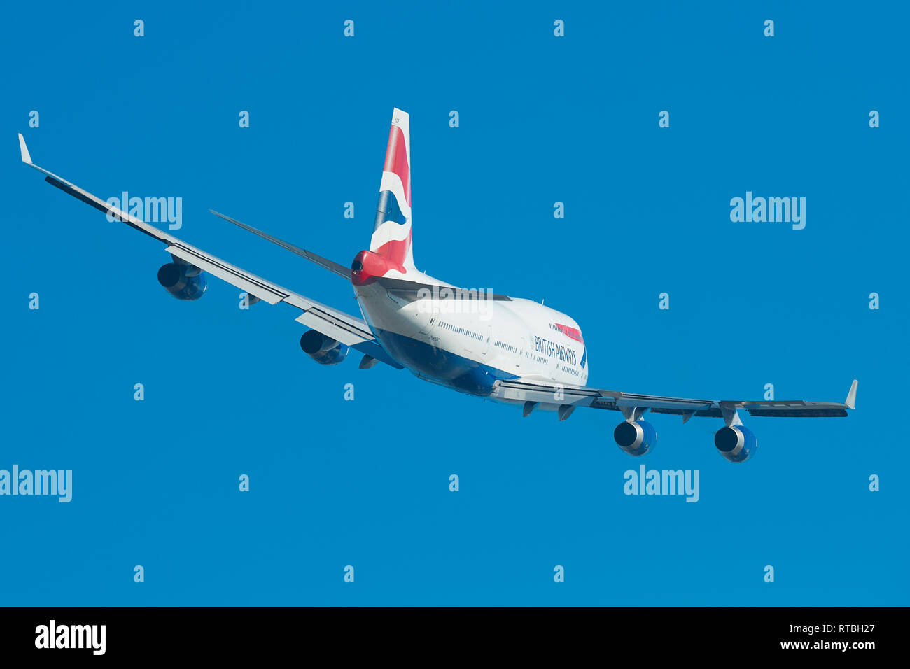 A British Airways Boeing 747-400 Banks As It Climbs Away From London's Heathrow Airport, UK. Stock Photo