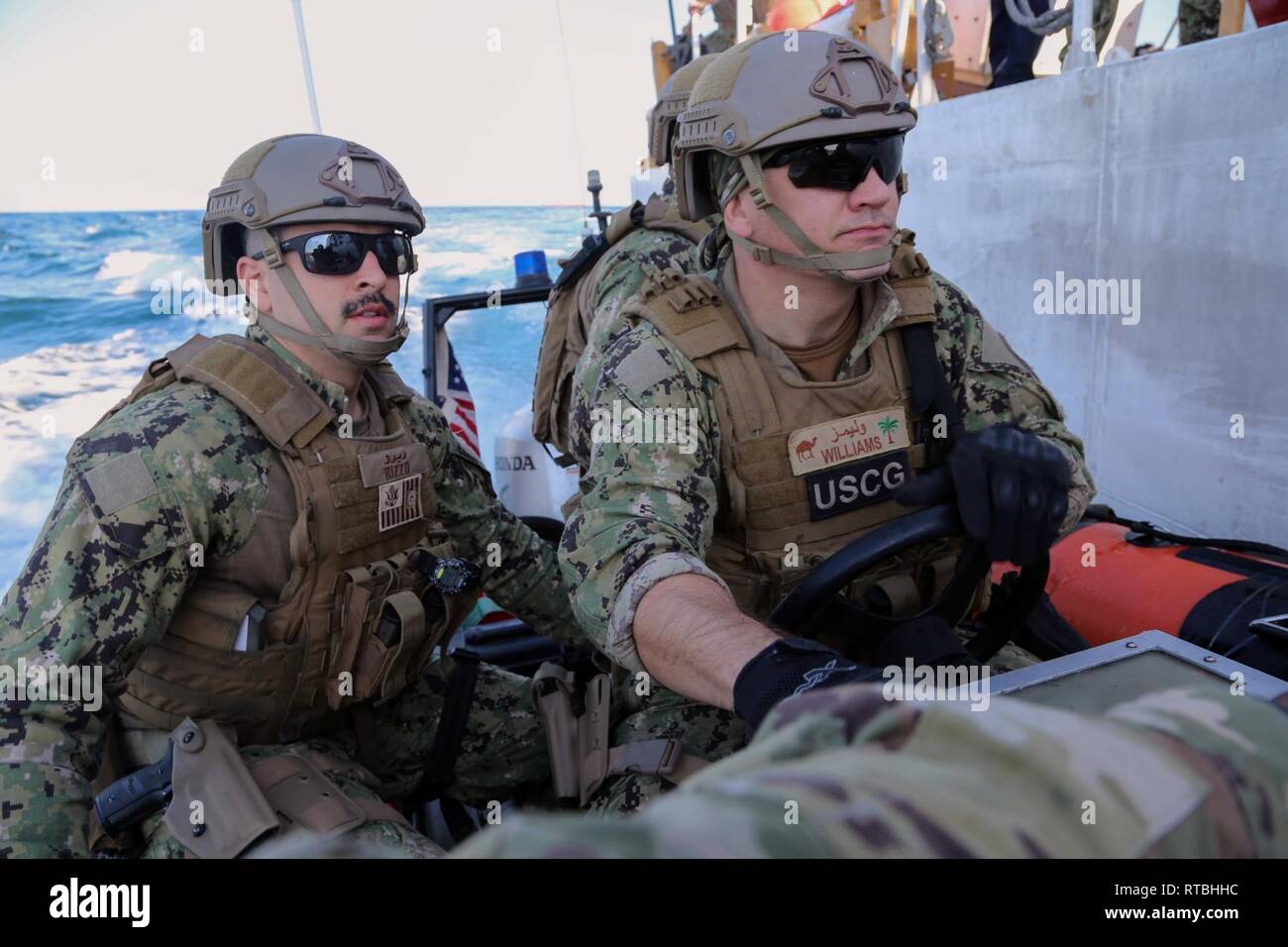 ARABIAN GULF (Feb. 07, 2019) U.S. Coast Guard Lt. j.g. James Rizzo ,left, and Boatswain's Mate