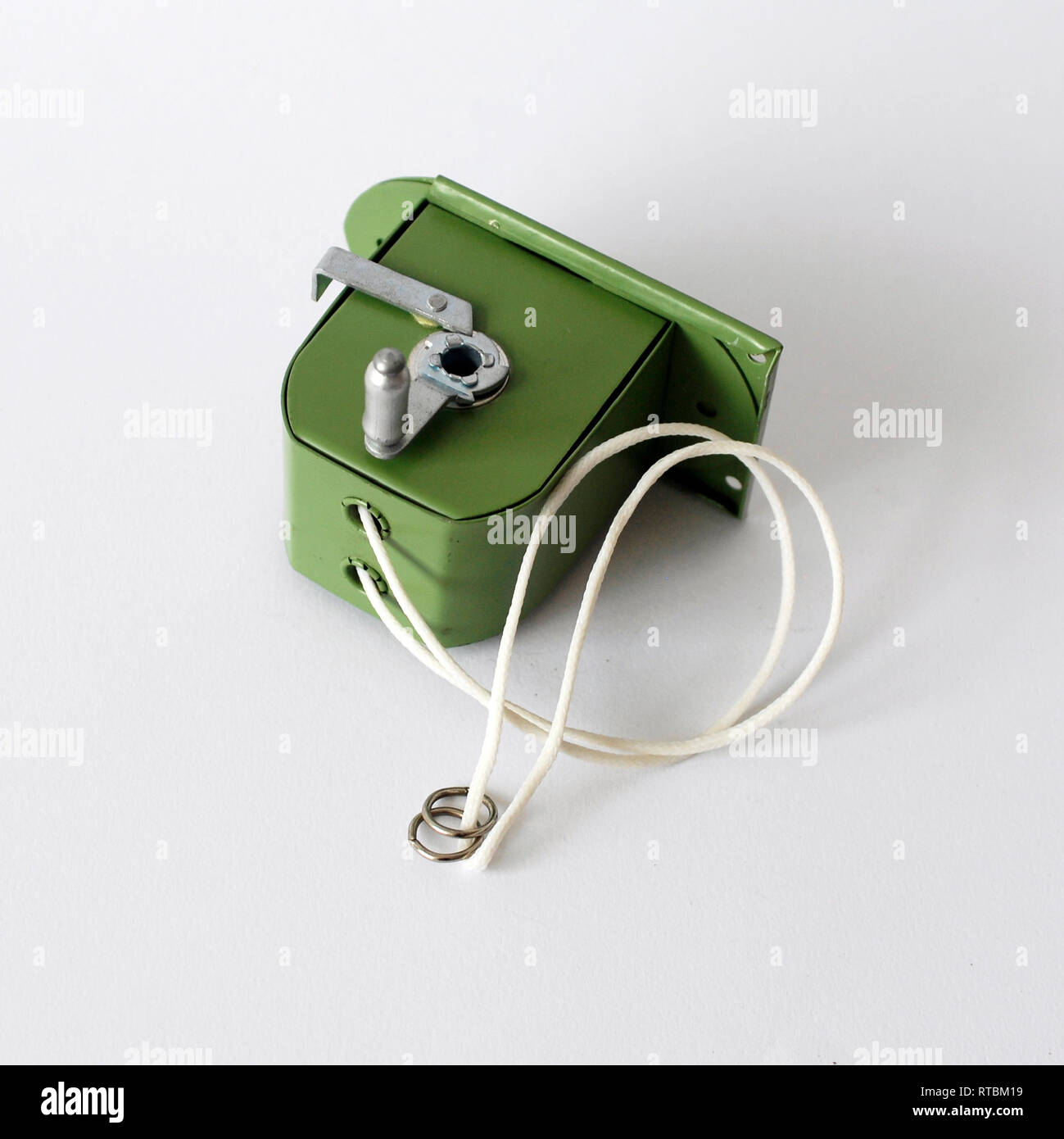 Photograph of a vintage green metal clothesline isolated on white