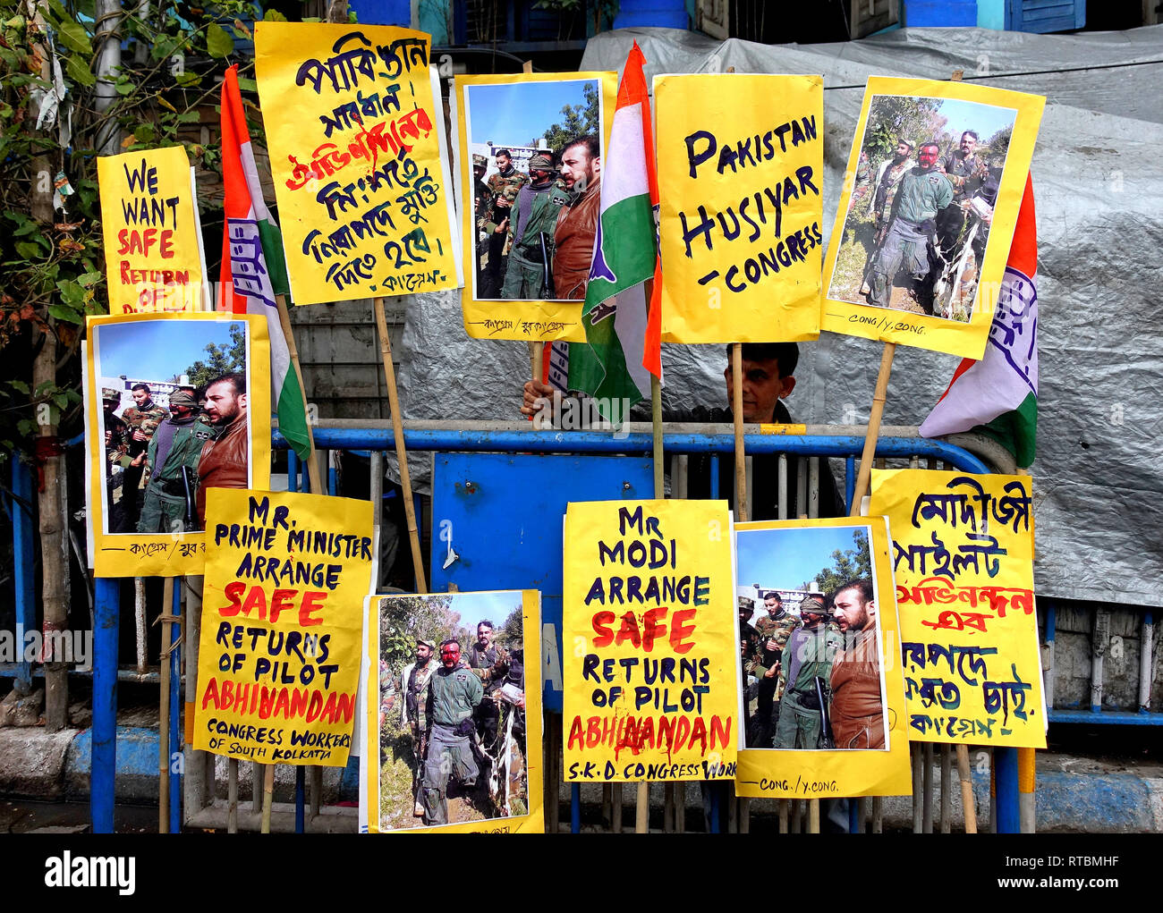 Placards are seen hanging at the traffic police gate during the protest against Pakistan and demand for a safe return of the Indian air force Pilot Abhinandan Vardaman to India who was captured by the Pakistan Army yesterday. Stock Photo