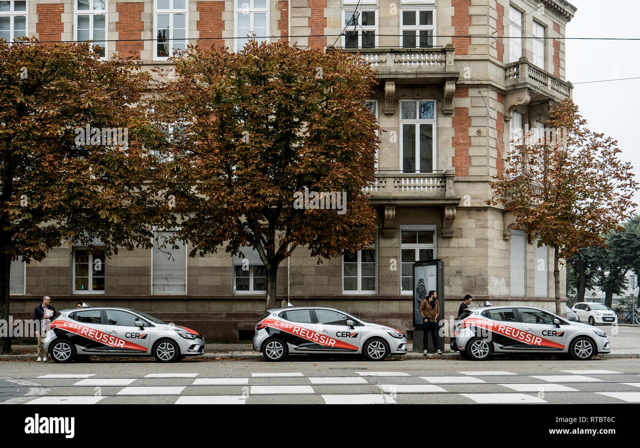 STRASBOURG, FRANCE - SEP 25, 2017: Cars from French driving license school with students and instructors preparing for in-car instruction  Stock Photo