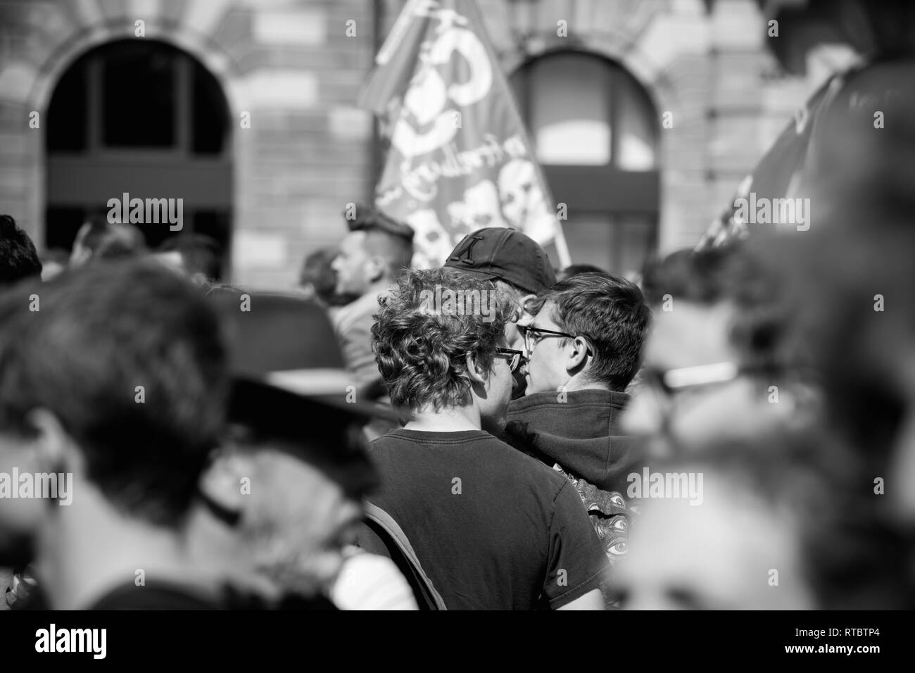 STRASBOURG, FRANCE - SEPT 12, 2017: Black and white demonstrators walk at political march during a French Nationwide day of protest against the labor reform proposed by Emmanuel Macron Government Stock Photo