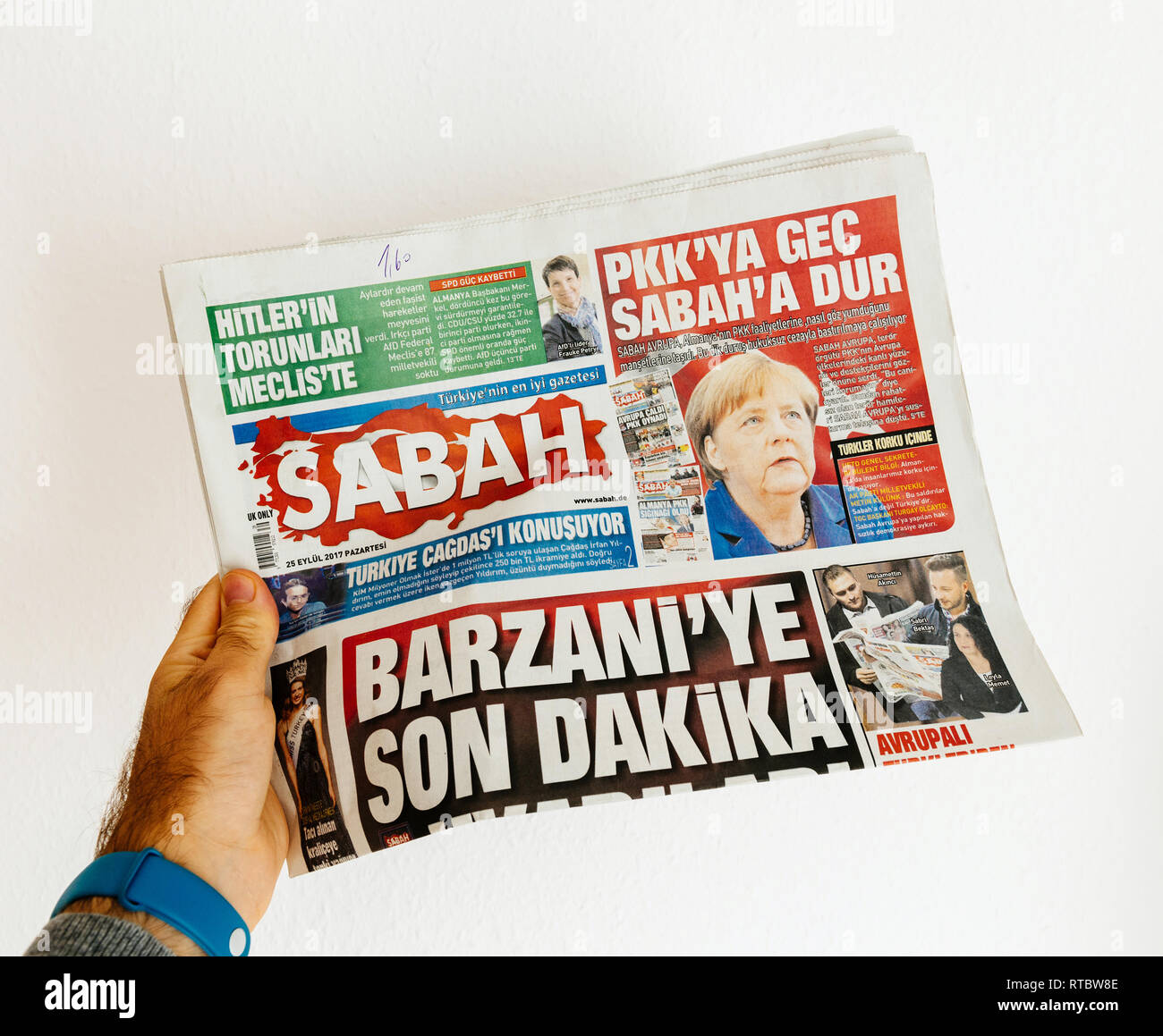 PARIS, FRANCE - SEP 25, 2017: Sabah  Turkish daily newspaper with portrait of Angela Merkel after election in Germany for the Chancellor of Germany, the head of the federal government Stock Photo