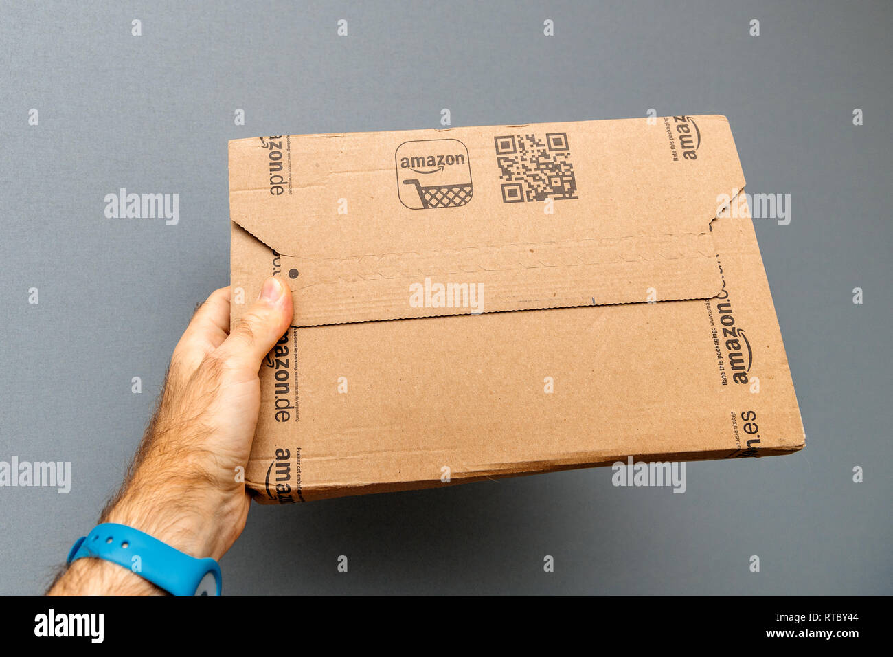 Paris France Oct 30 17 Man Holding Amazon Prime Cardboard Delivery Box Against Gray Background Stock Photo Alamy