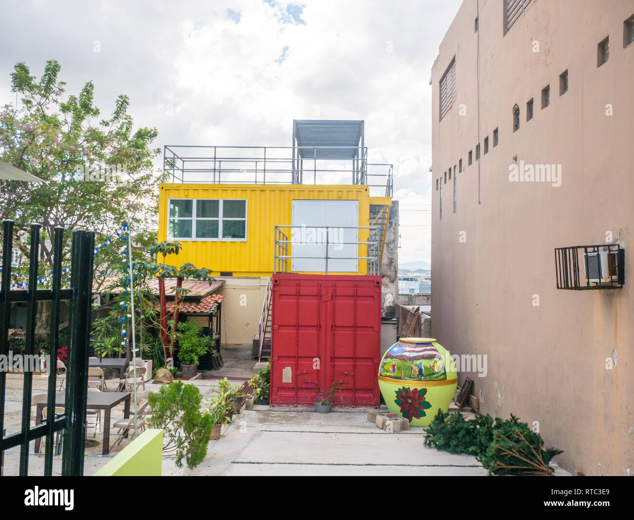 Old San JUan, PUerto Rico. January 2019. A house built with a red and a yellow container. Stock Photo