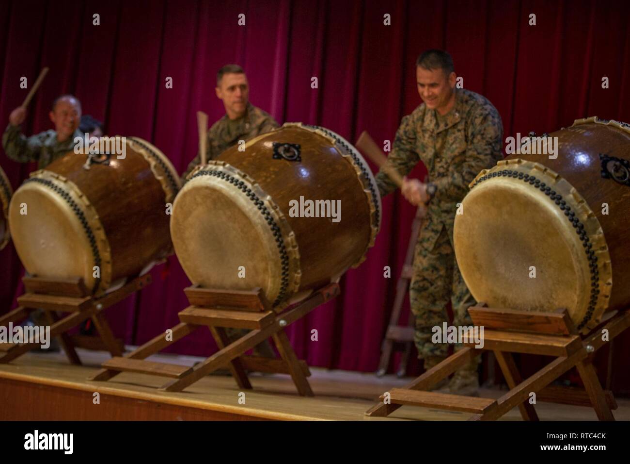 U.S. Marine Corps Maj. Gen. Robert Castellvi, Col. Kevin Clark and Japan Ground Self-Defense Force Maj. Gen. Shinichi Aoki participate in a drum performance during the closing ceremony for exercise Iron Fist 2019, Feb. 8, on U.S. Marine Corps Base Camp Pendleton, Calif. Exercise Iron Fist is an annual, multilateral training exercise where U.S. and Japanese service members train together and share techniques, tactics and procedures to improve their combined operational capabilities. Stock Photo