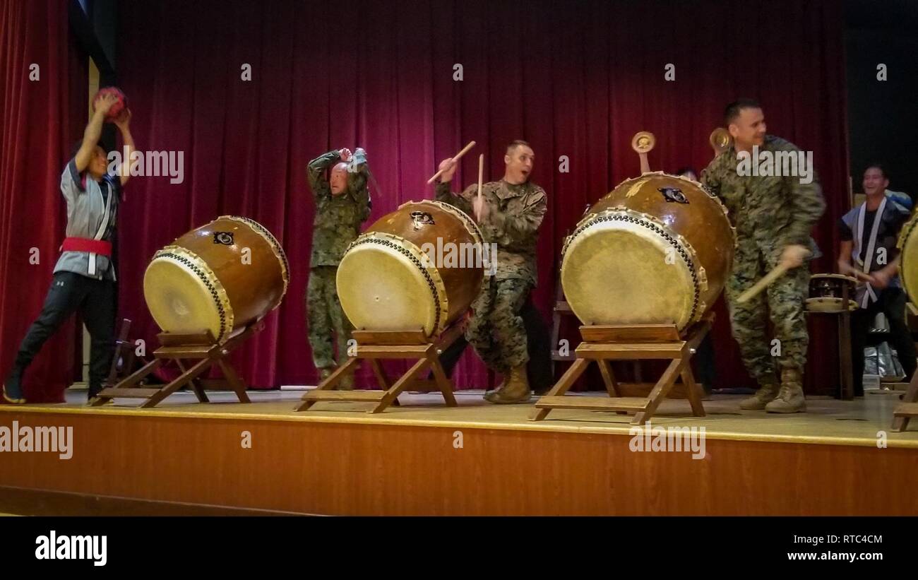 U.S. Marine Corps Maj. Gen. Robert Castellvi, Col. Kevin Clark and Japan Ground Self-Defense Force Maj. Gen. Shinichi Aoki participate in a drum performance during the closing ceremony for exercise Iron Fist 2019, Feb. 8, on U.S. Marine Corps Base Camp Pendleton, Calif. Exercise Iron Fist is an annual, multilateral training exercise where U.S. and Japanese service members train together and share techniques, tactics and procedures to improve their combined operational capabilities. Stock Photo