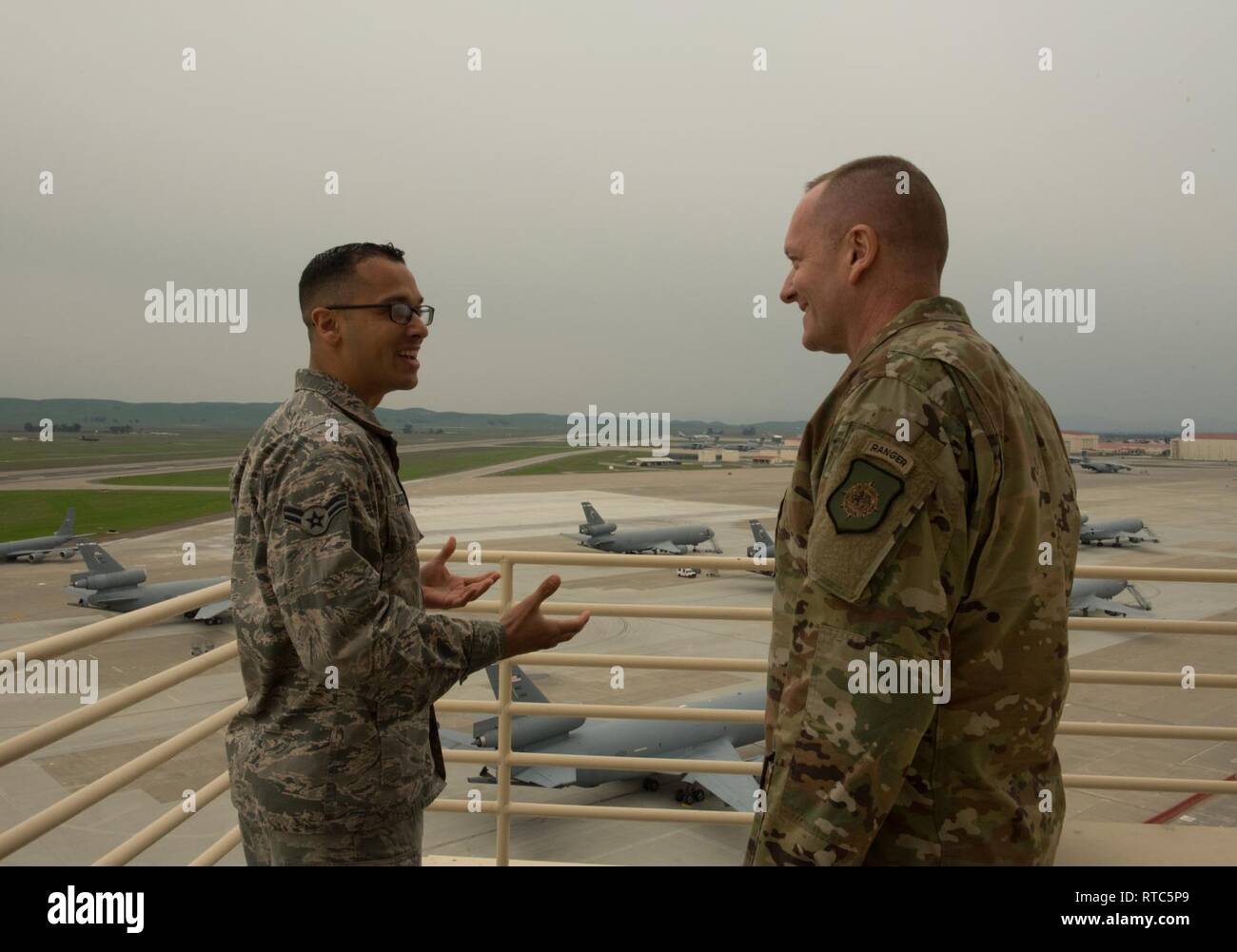 U.S. Air Force Chief Master Sgt. Jason France, U.S. Transportation Command  senior enlisted leader, is given a tour of the air traffic control tower by  Airman 1st Class Michael Rodriguez, 60th Operations