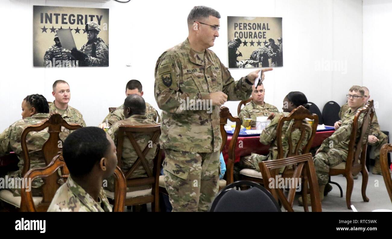Brig. Gen. Clint Walker, commanding general of 184th Sustainment Command, speaks to his unit's enlisted Soldiers during a dinner at Camp Arifjan, Kuwait, Feb. 6, 2019. Stock Photo