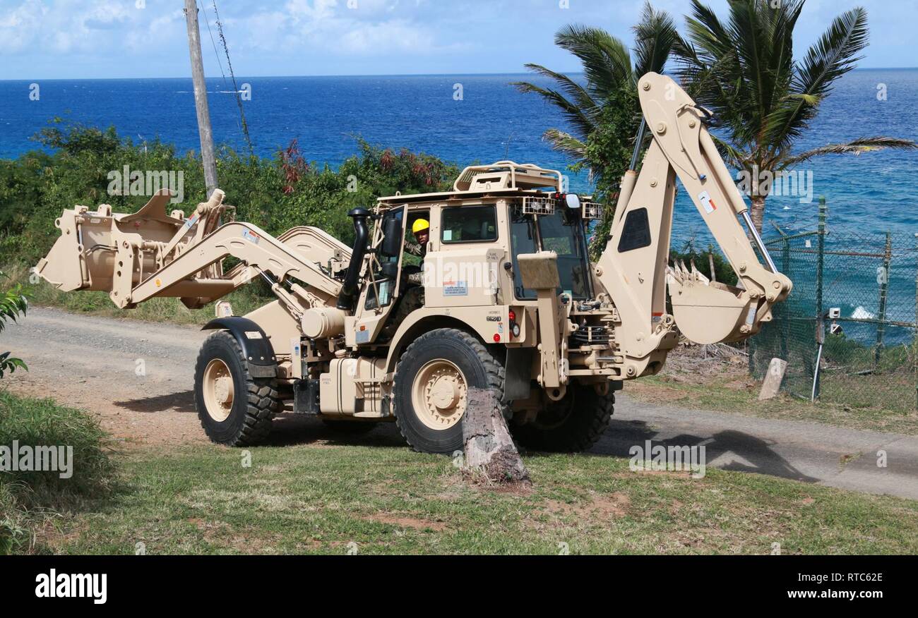 Spc. Abednego L. Petrus, a member of the 662nd Engineer Company, Virgin Islands National Guard prepares to do road work, operating the High Mobility Engineer Excavator Type 1 Tractor at Hams Bluff St. Croix, Feb. 09, 2019. The 662nd EN Co will be conducting MOS related training throughout this month’s inactive duty training (IDT). Stock Photo