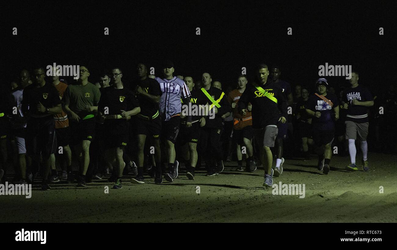 Soldiers from the 300th Sustainment Brigade participate in the brigade run at Camp Arifjan, Kuwait, Feb. 9, 2019. Stock Photo