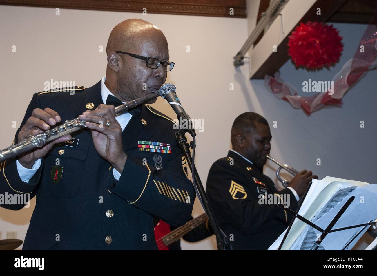 Staff Sgt. Michael Cheatham of Charlotte, N.C., plays flute with ...