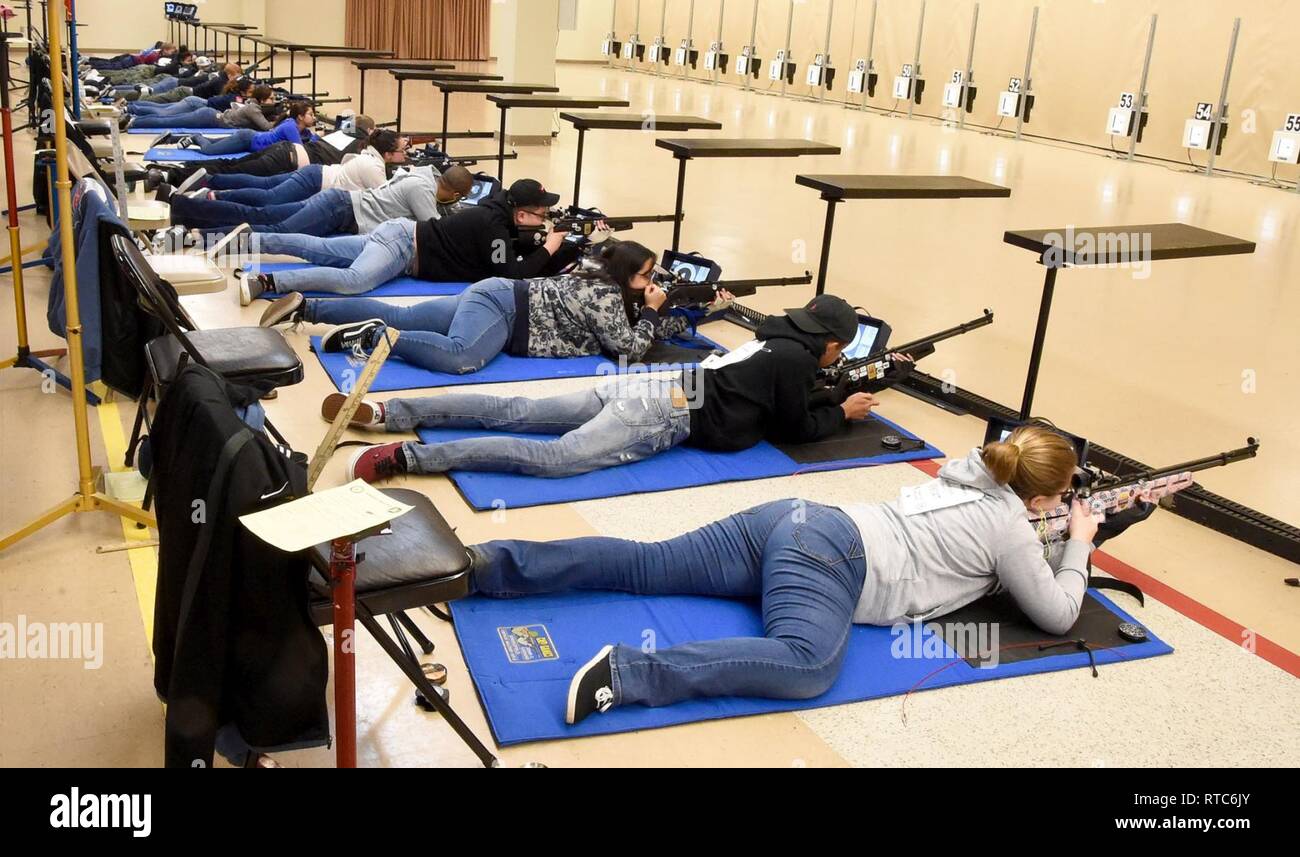 ANNISTON, Ala., (February 9, 2019) – Navy Junior Reserve Officers Training Corps (NJROTC) cadets fire air rifles in the prone position during the Sporter Division portion of the NJROTC Air Rifle Championship in Anniston, Ala., Feb. 8-9. Nearly 200 NJROTC cadets from high schools across the United States participated in the competition. Stock Photo