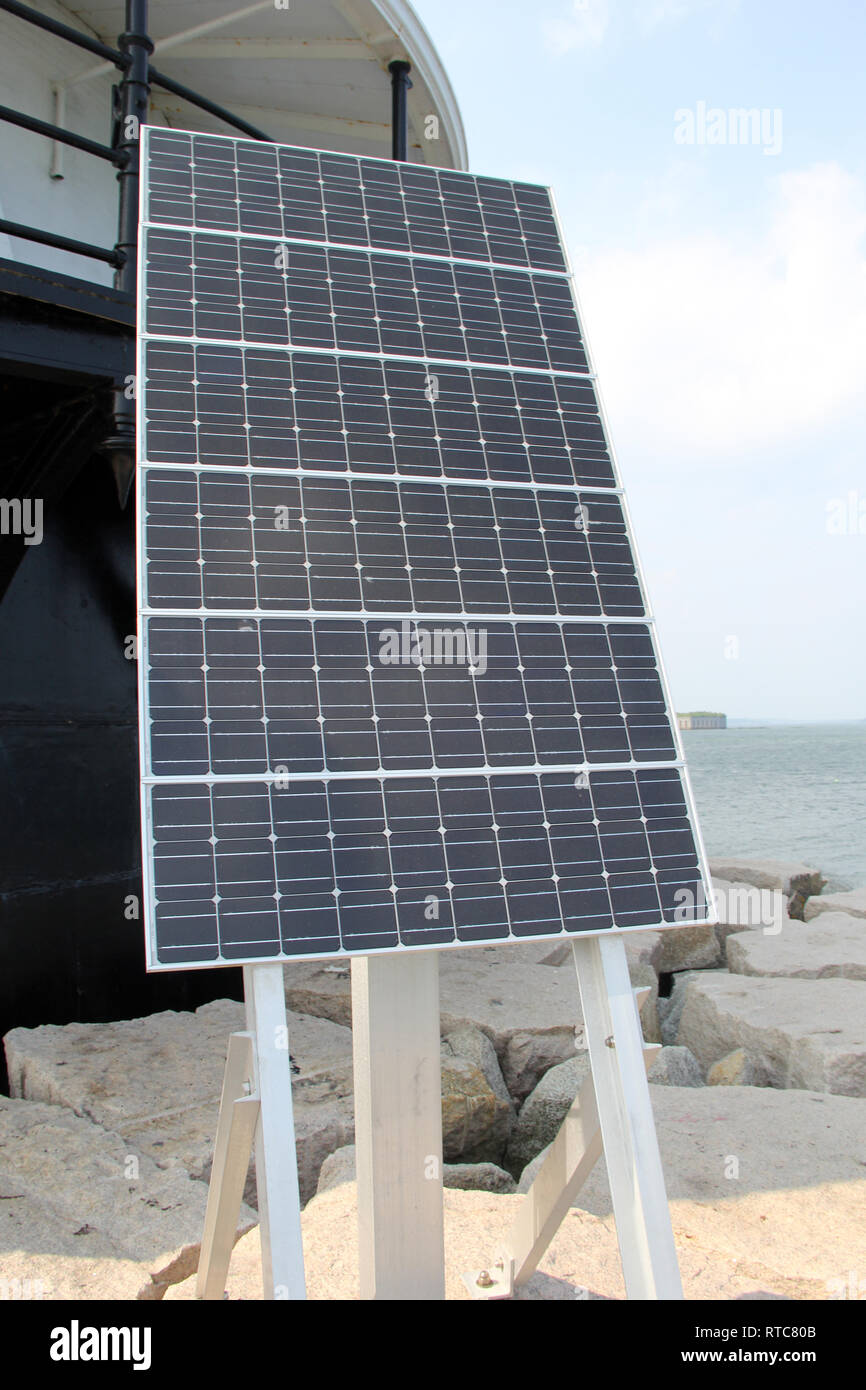 Solar Panel on an Ocean shoreline making energy Stock Photo